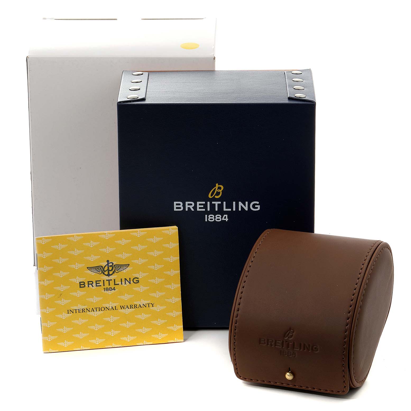 The image shows the accessories for a Breitling Navitimer A13022 Men's Stainless Steel Black Dial A13022 Men's Stainless Steel Black Dial, including a brown leather case, a warranty card, and a branded box.