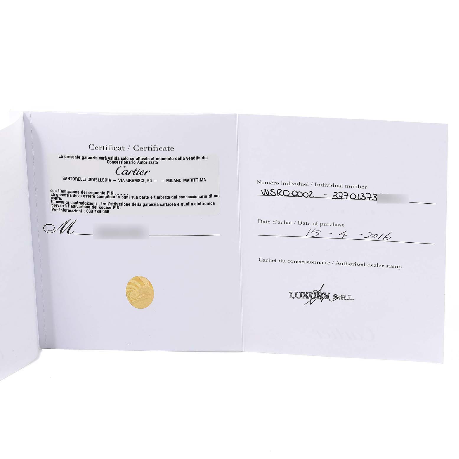 This image shows a Cartier Rotonde WSRO0002 Men's Stainless Steel Silver Dial WSRO0002 Men's Stainless Steel Silver Dial watch's certificate and warranty card, including the purchase date and dealer's stamp.