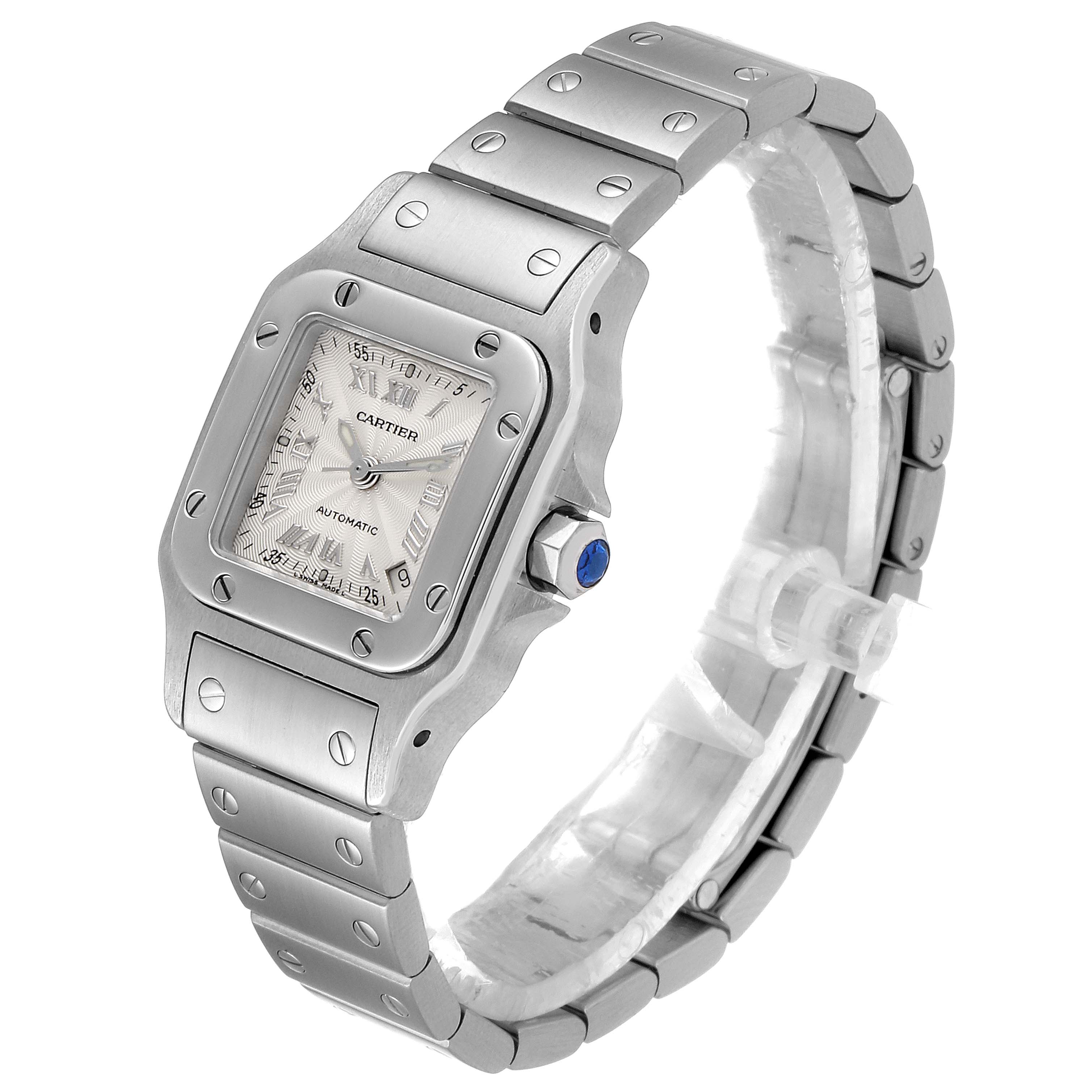 The Cartier Santos W20044D6 Women
s Stainless Steel Silver Dial W20044D6 Women
s Stainless Steel Silver Dial watch is shown at an angled view, displaying its face, bezel, crown, and part of the bracelet.