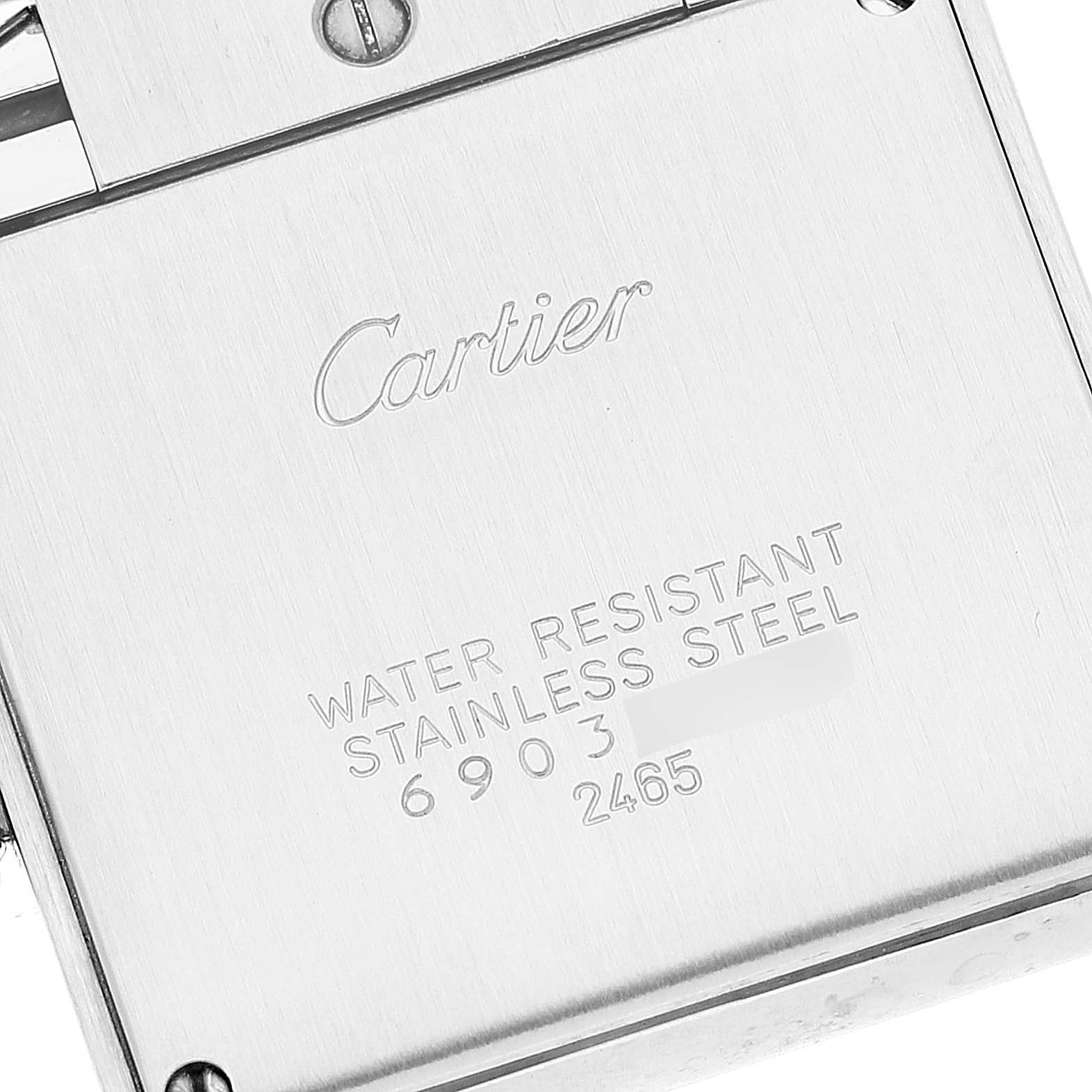 The image shows the case back of a Cartier Tank Française watch, highlighting the water resistance and stainless steel details.