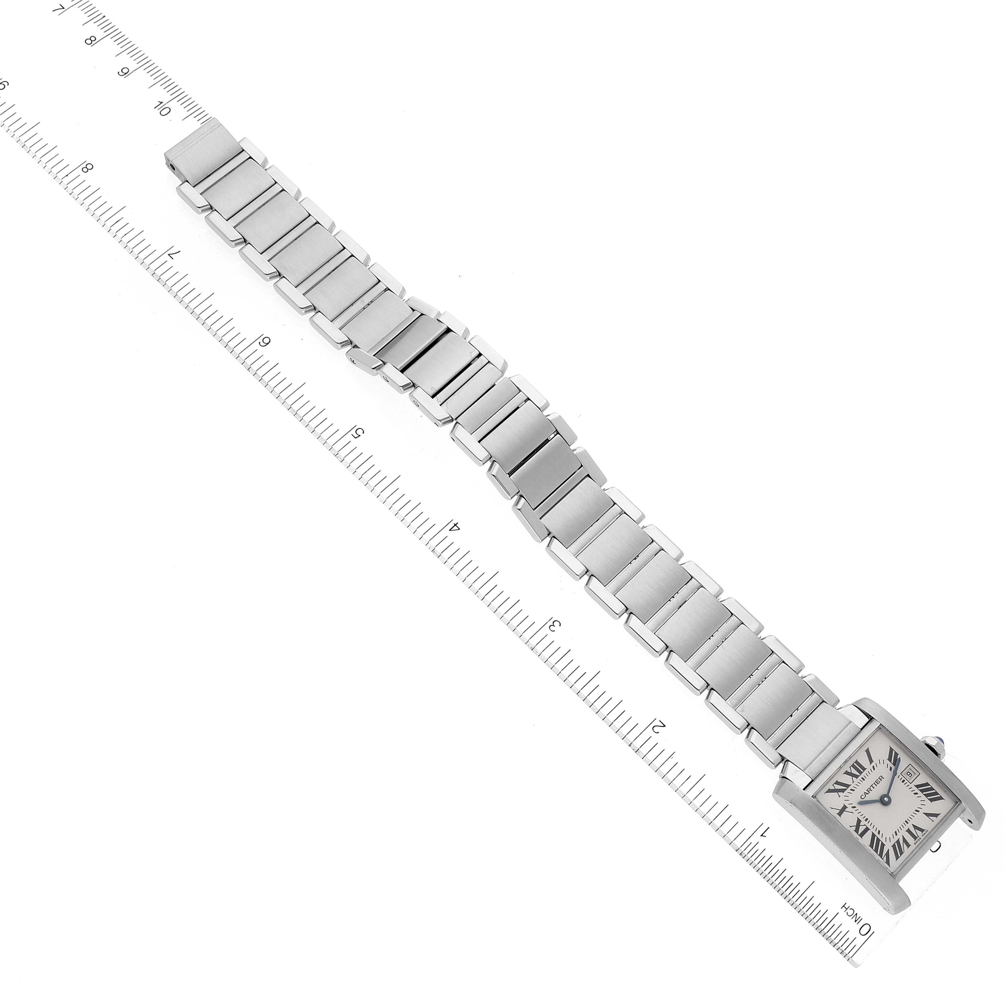 The Cartier Tank Francaise W51011Q3 Women's Stainless Steel Silver Dial W51011Q3 Women's Stainless Steel Silver Dial watch is shown from a top-down angle, displaying the band and the square face alongside a ruler for scale.
