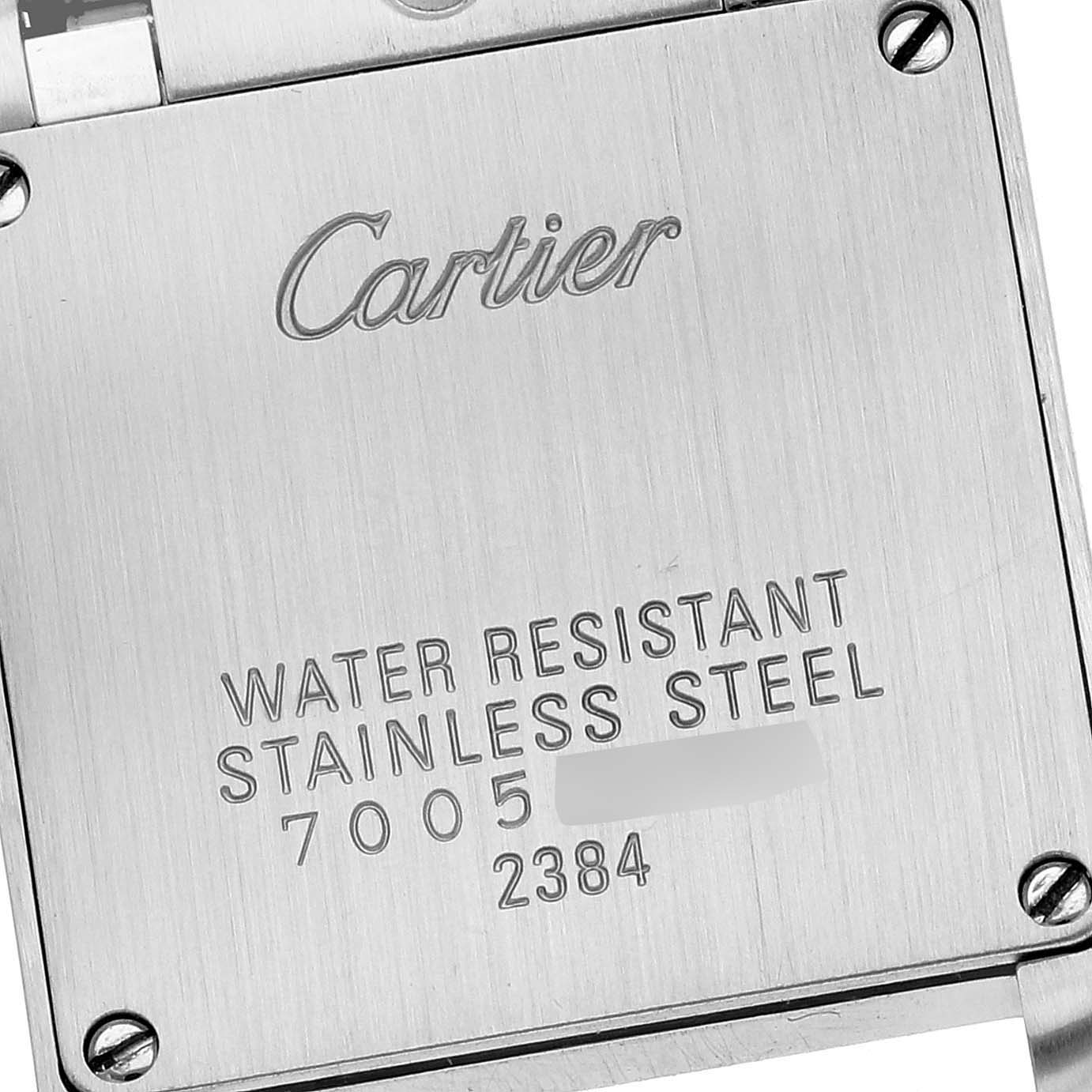 The image shows the stainless steel backplate of a Cartier Tank Française watch, featuring engraved specifications.