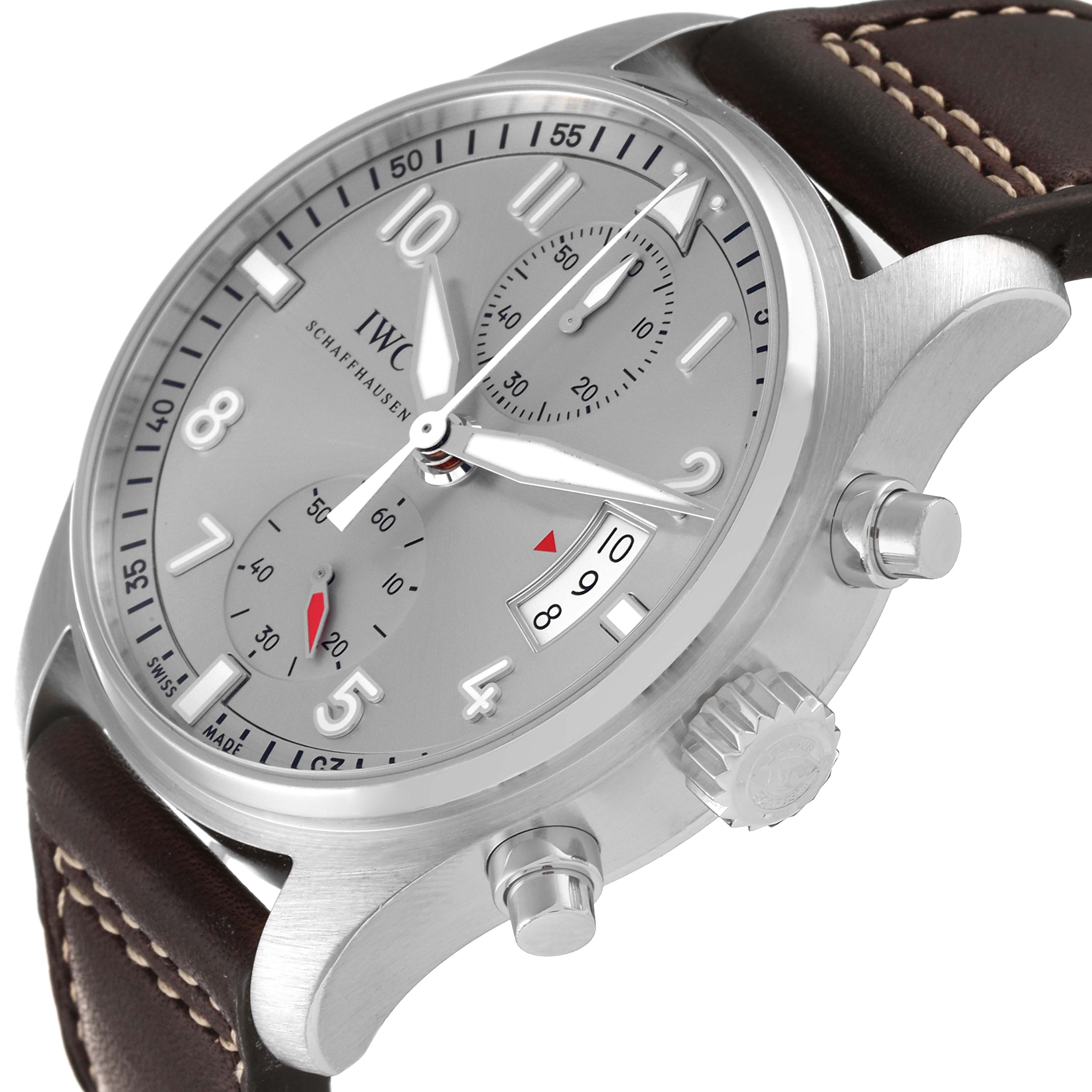The image shows an angled close-up view of an IWC Pilot IW387809 Men's Stainless Steel Silver Dial IW387809 Men's Stainless Steel Silver Dial watch, highlighting its dial, crown, pushers, and strap.