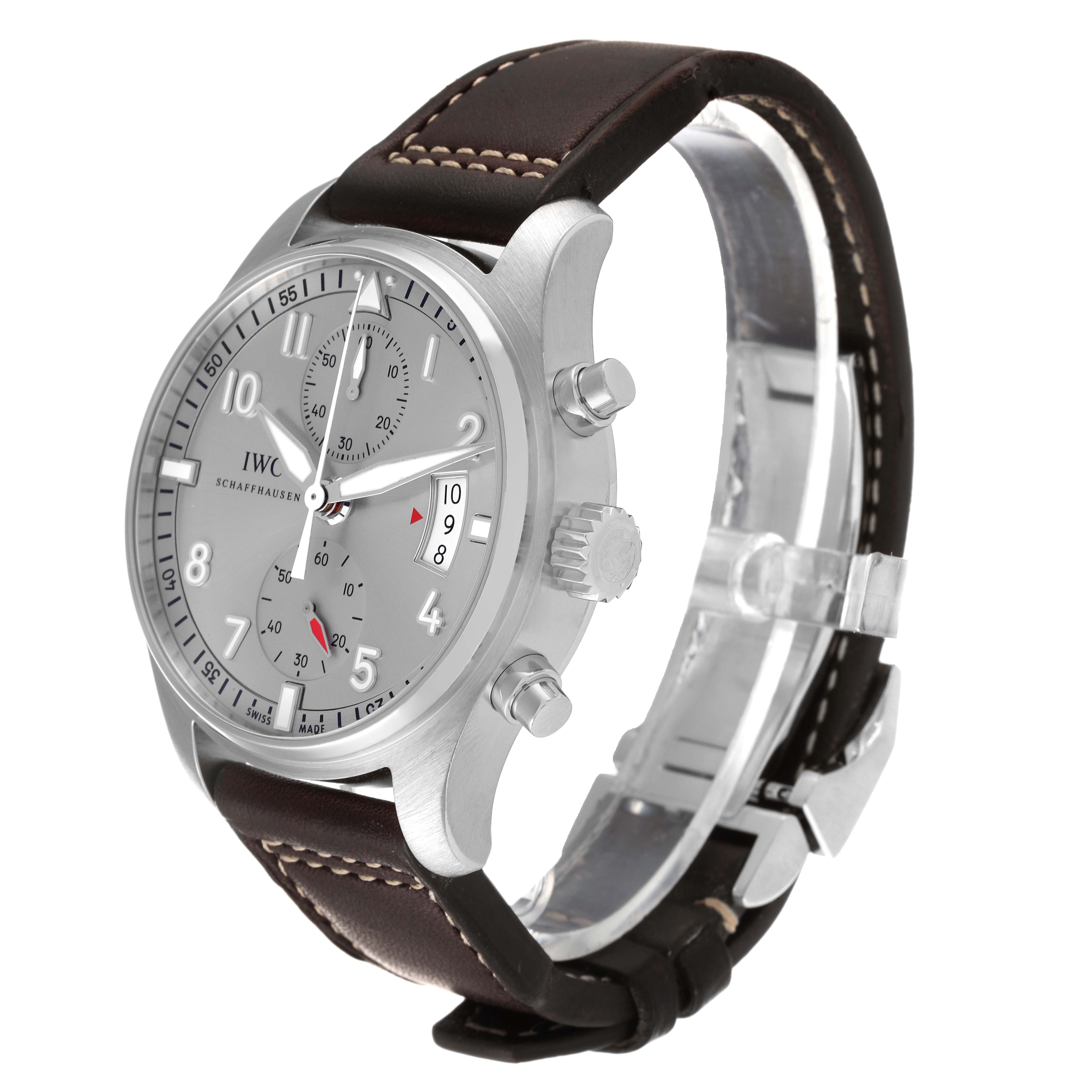 The image shows a side angle of an IWC Pilot IW387809 Men's Stainless Steel Silver Dial IW387809 Men's Stainless Steel Silver Dial model watch, showcasing the face, crown, pushers, and leather strap.