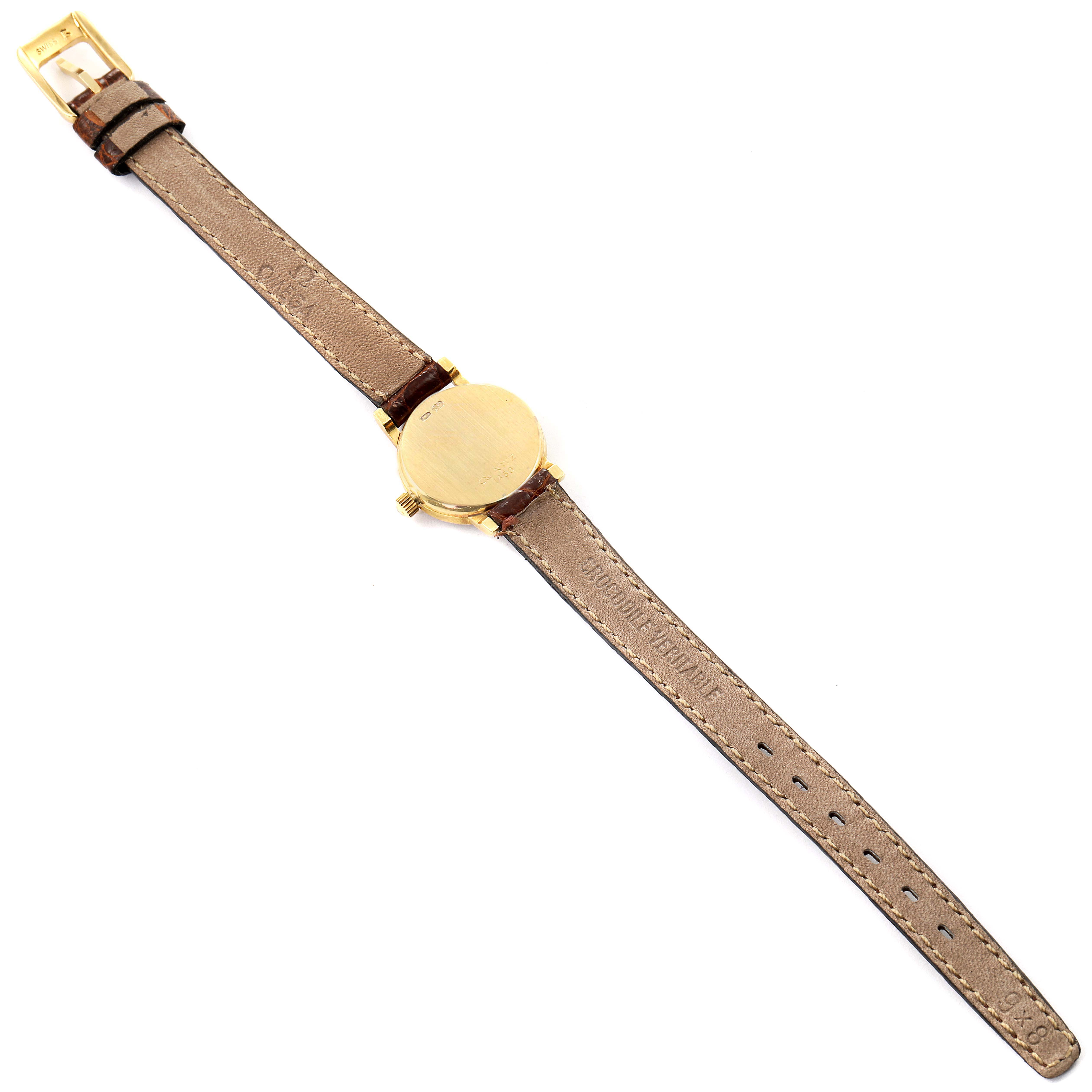 The image shows the back of the Omega 1450 Women's Yellow Gold Champagne Dial 1450 Women's Yellow Gold Champagne Dial DeVille Mini Yellow Gold Diamond Cocktail Ladies Watch 1450 Unworn model laying flat and fully extended.
