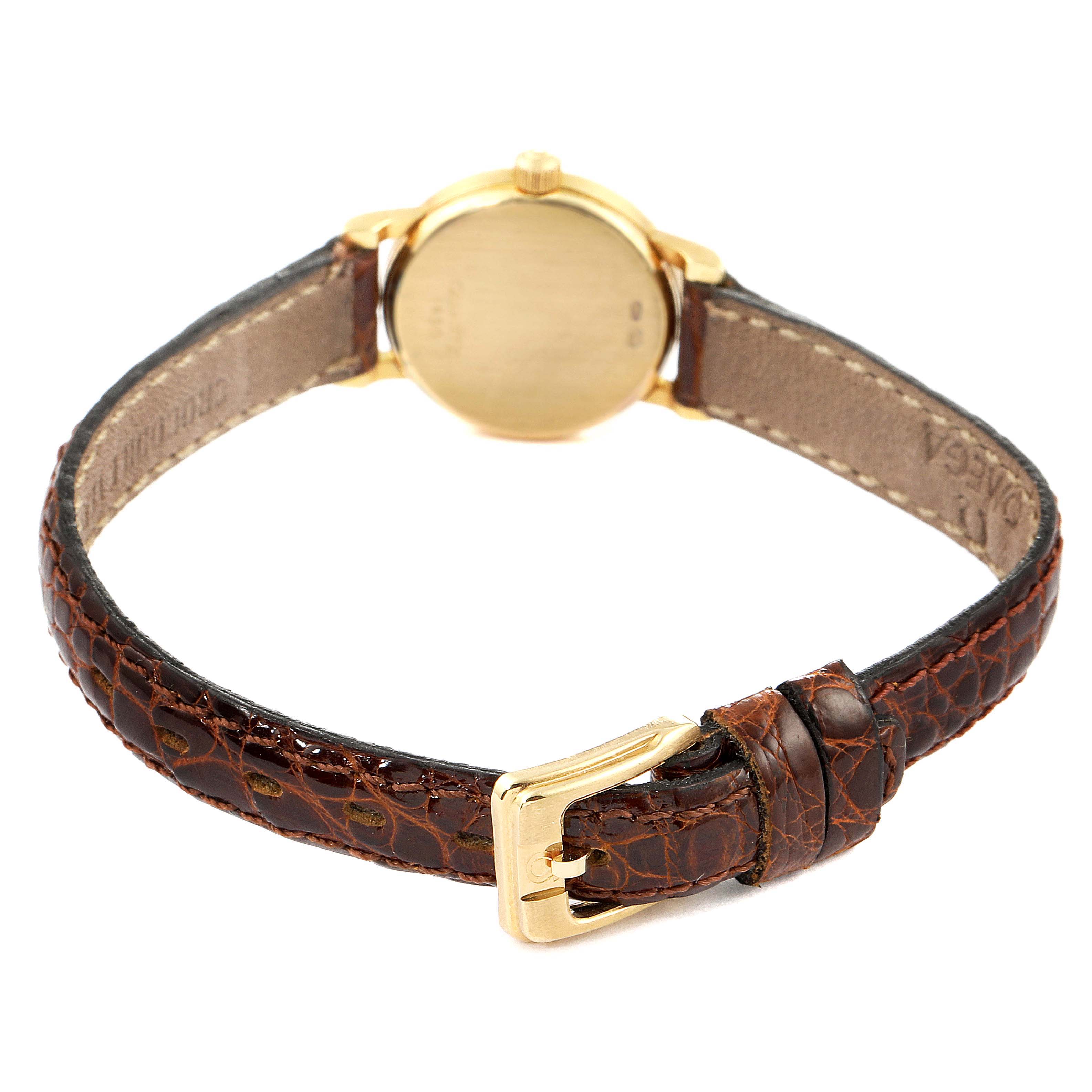 This image shows the back case and brown leather strap of the Omega 1450 Women's Yellow Gold Champagne Dial 1450 Women's Yellow Gold Champagne Dial DeVille Mini Yellow Gold Diamond Cocktail Ladies Watch 1450.