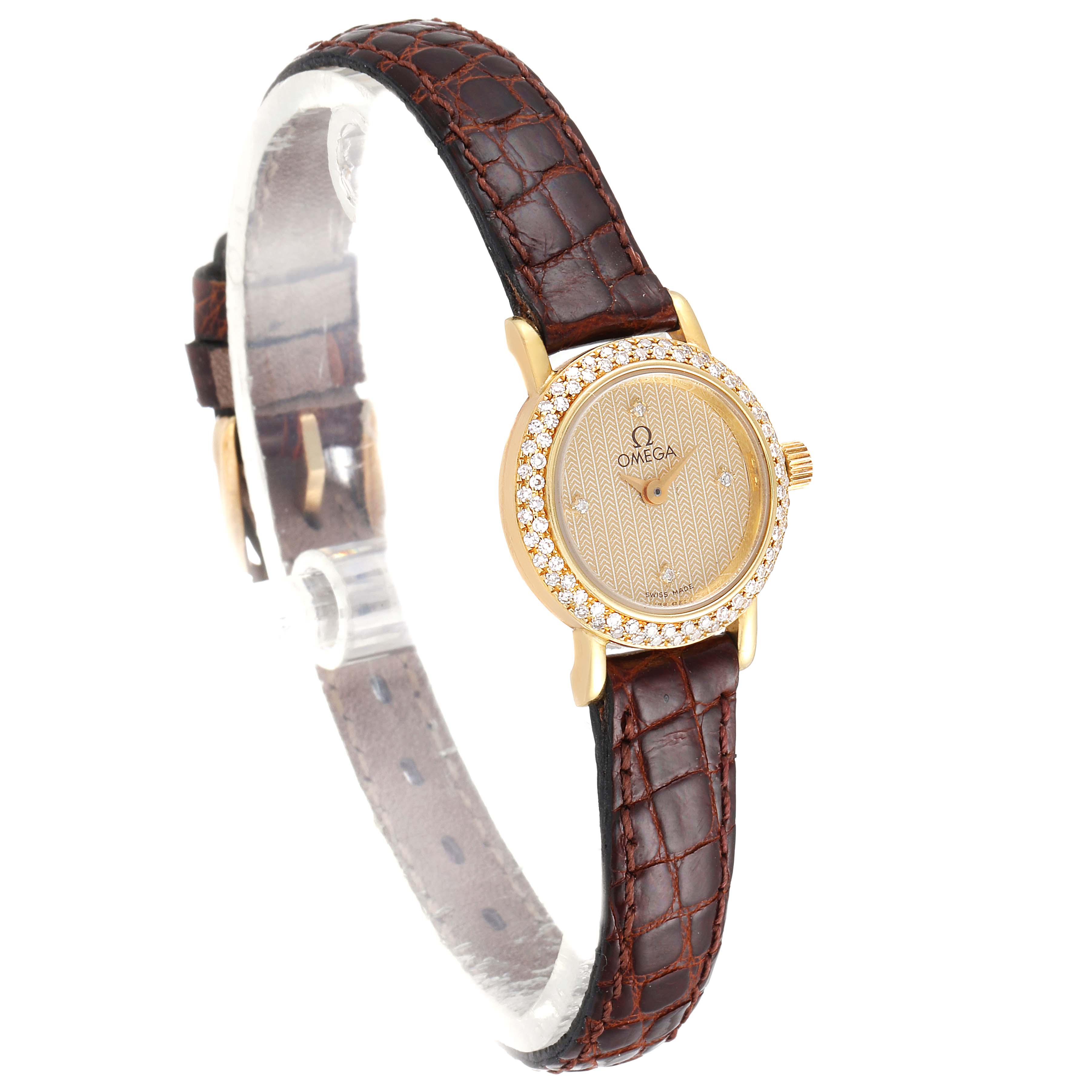 This image shows the front and side view of the Omega 1450 Women's Yellow Gold Champagne Dial 1450 Women's Yellow Gold Champagne Dial DeVille Mini Yellow Gold Diamond Cocktail Ladies Watch 1450 with its brown leather strap.