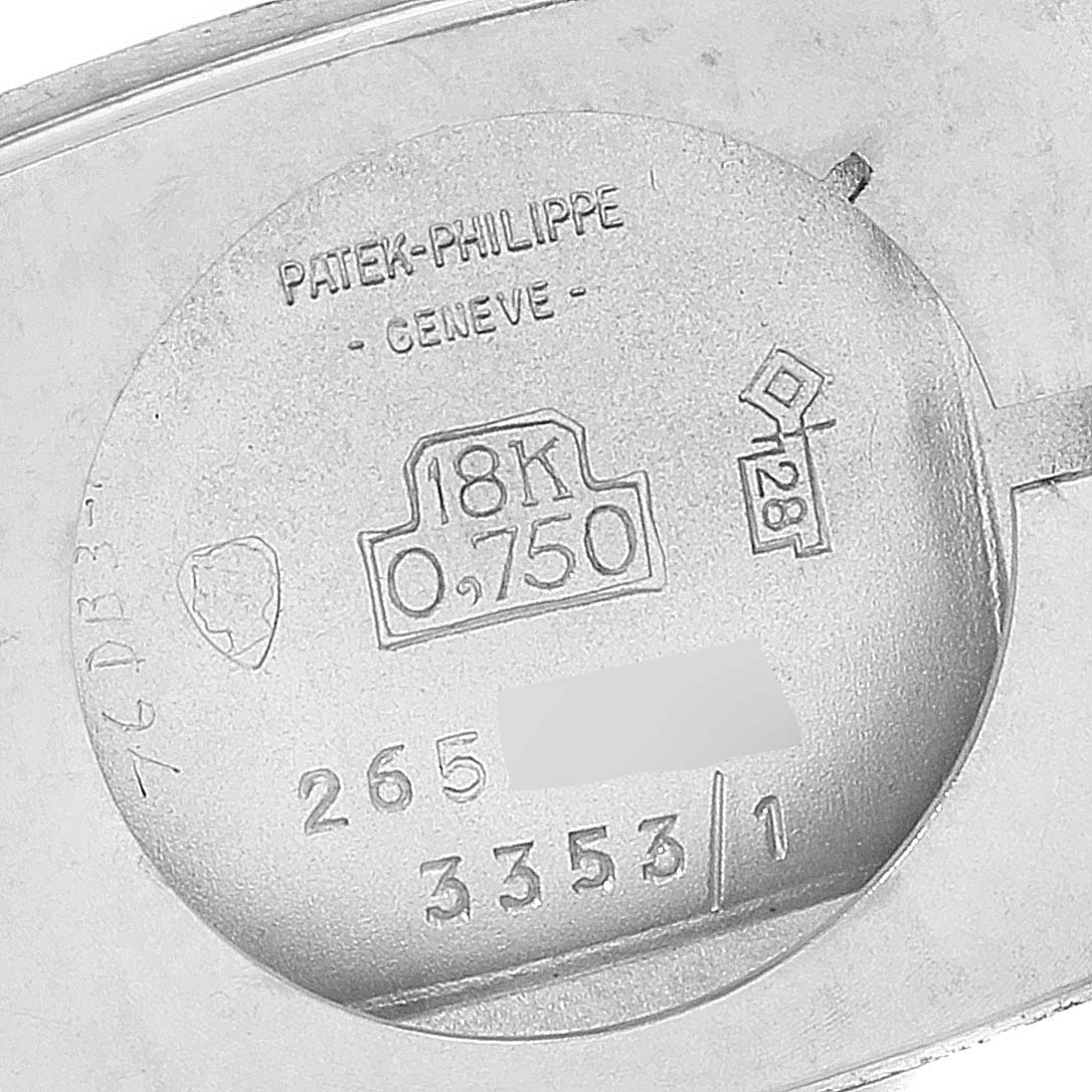 This image shows the back of the Patek Philippe 3353/1 Women
s White Gold Grey Dial 3353/1 Women
s White Gold Grey Dial 3353 model, highlighting the 18k white gold hallmarks.