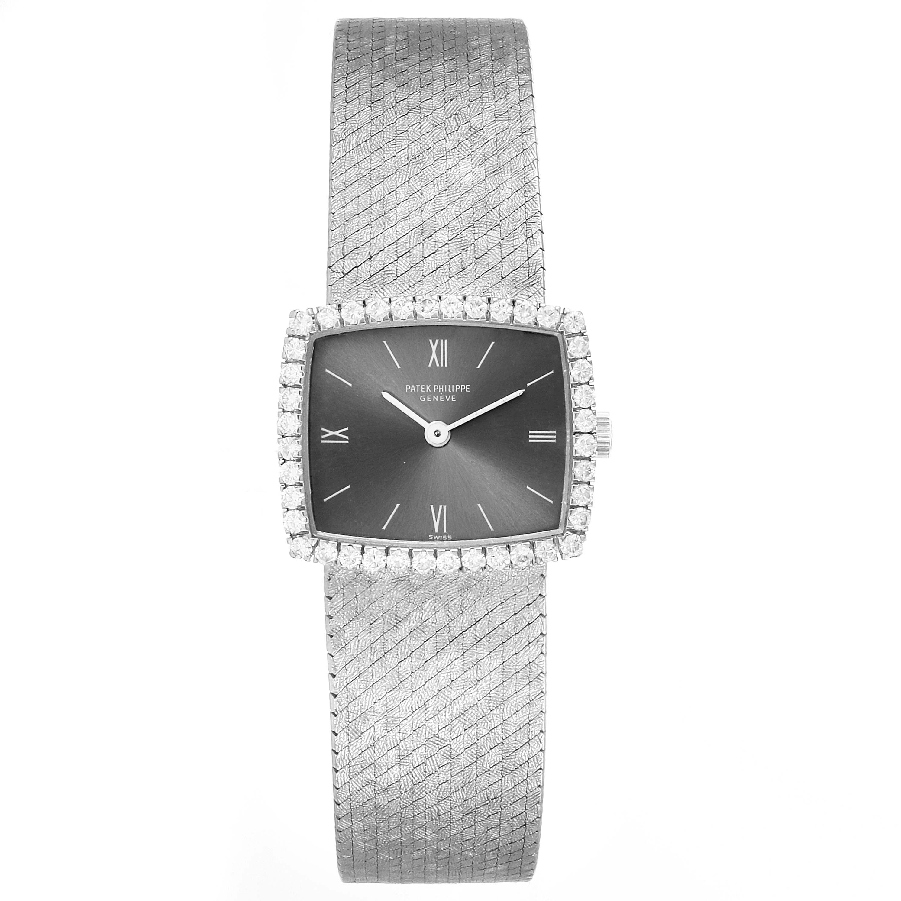 The Patek Philippe 3353/1 Women
s White Gold Grey Dial 3353/1 Women
s White Gold Grey Dial 3353 model, an 18k white gold diamond bezel ladies
 watch, is shown from a front angle displaying its face and band.