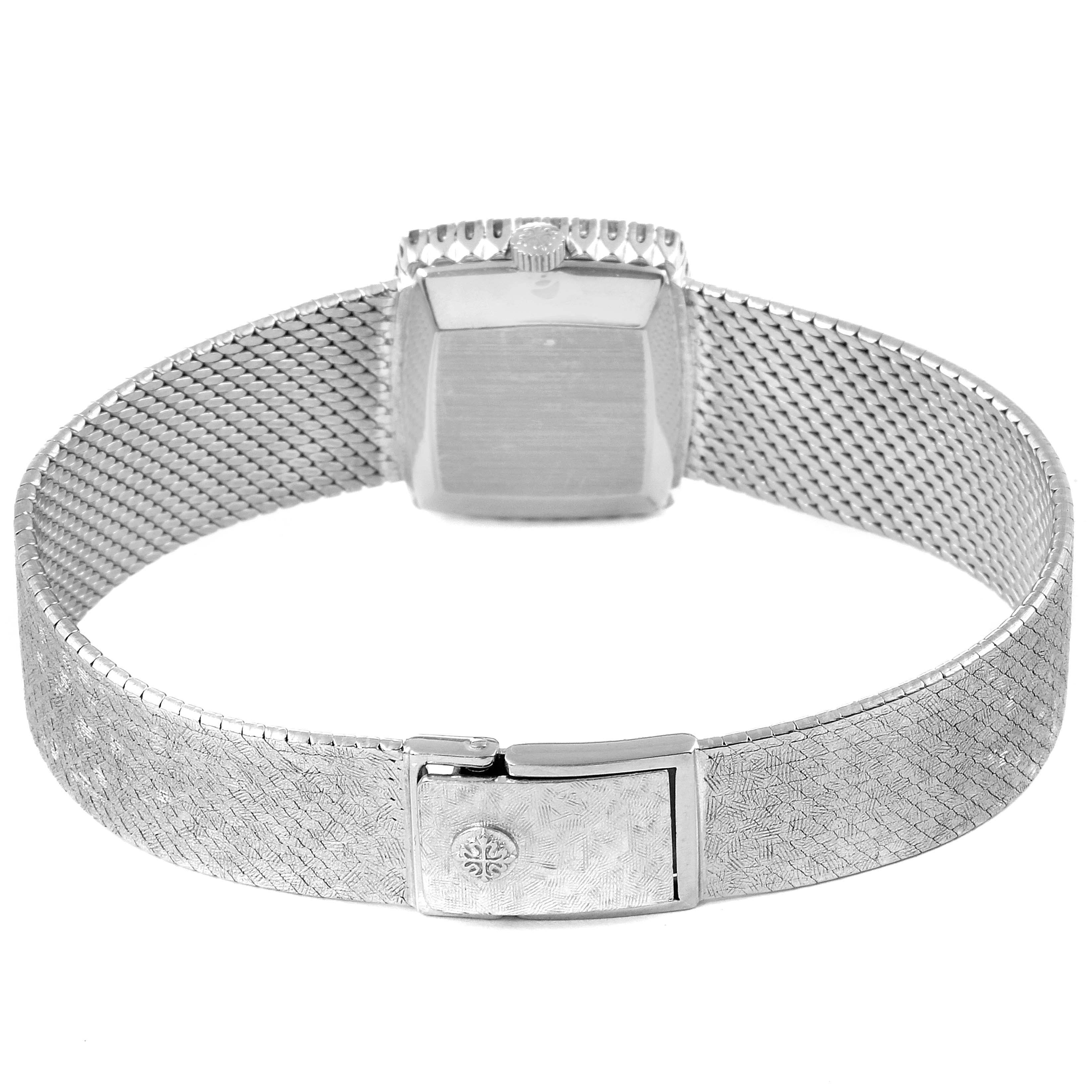The image shows the back view of the Patek Philippe 3353/1 Women
s White Gold Grey Dial 3353/1 Women
s White Gold Grey Dial 3353 ladies watch, highlighting the clasp and mesh band.