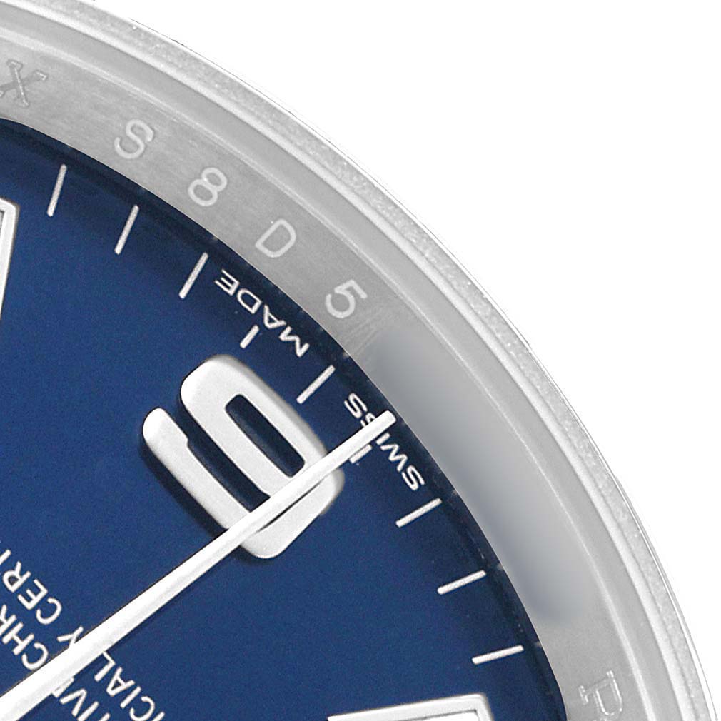 The image shows a close-up of the Rolex Air-King 114200 Men's Stainless Steel Blue Dial dial focusing on the 9 o'clock area and part of the bezel.