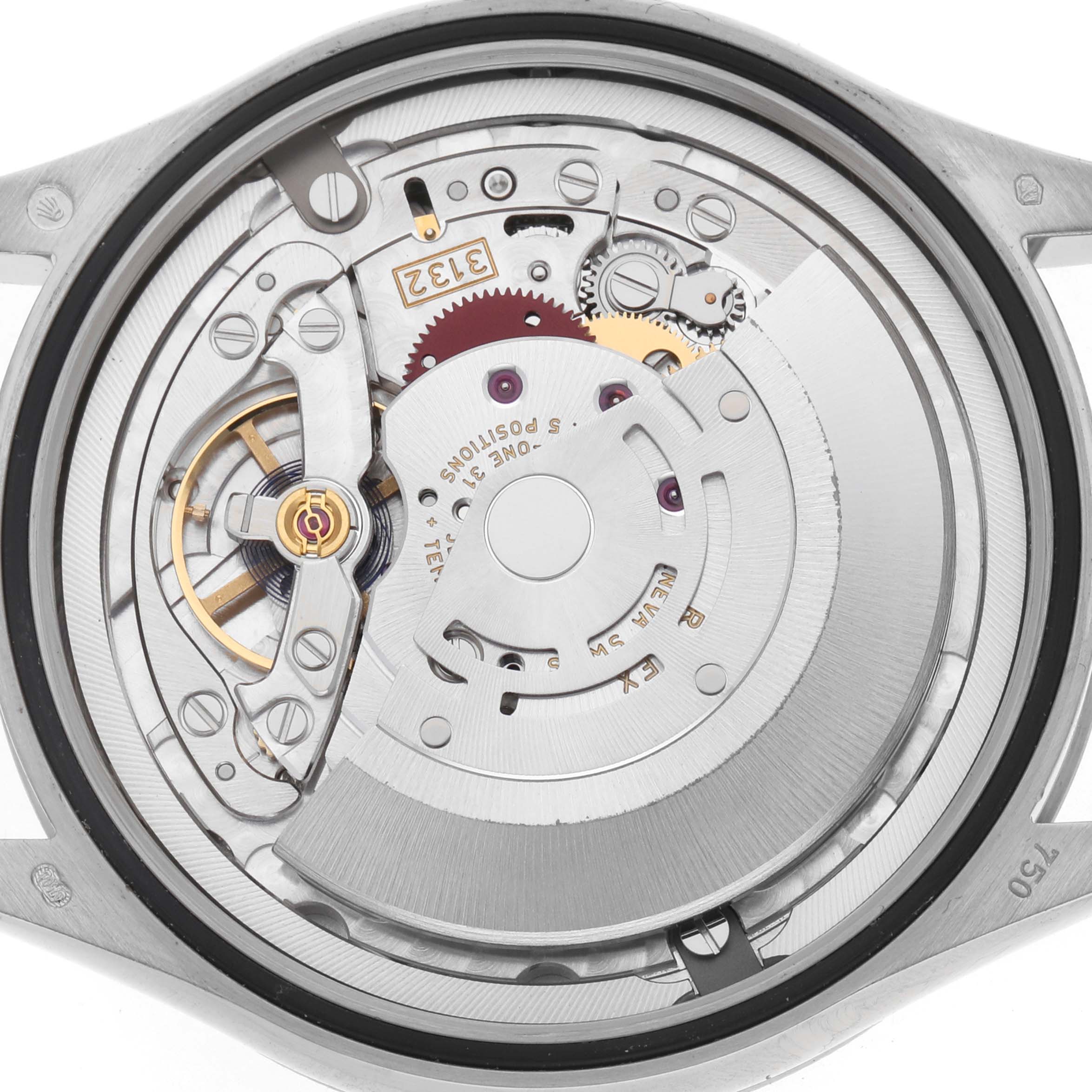 The image shows the Rolex Cellini 50509 Men's White Gold White Dial's movement from the back, highlighting gears, rotor, and intricate mechanical components.