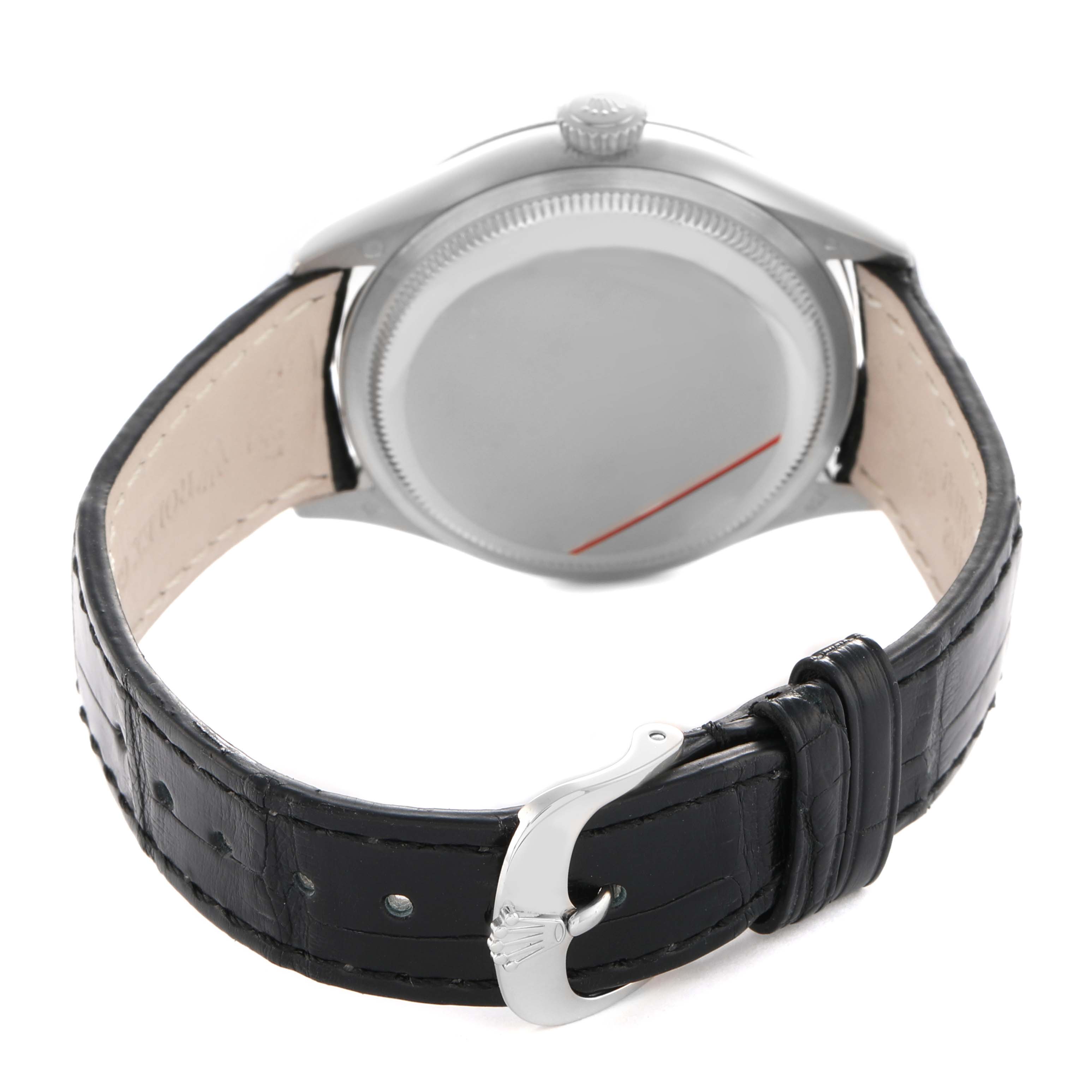 The Rolex Cellini 50509 Men's White Gold White Dial watch is shown from the back, highlighting the closed caseback and black leather strap.