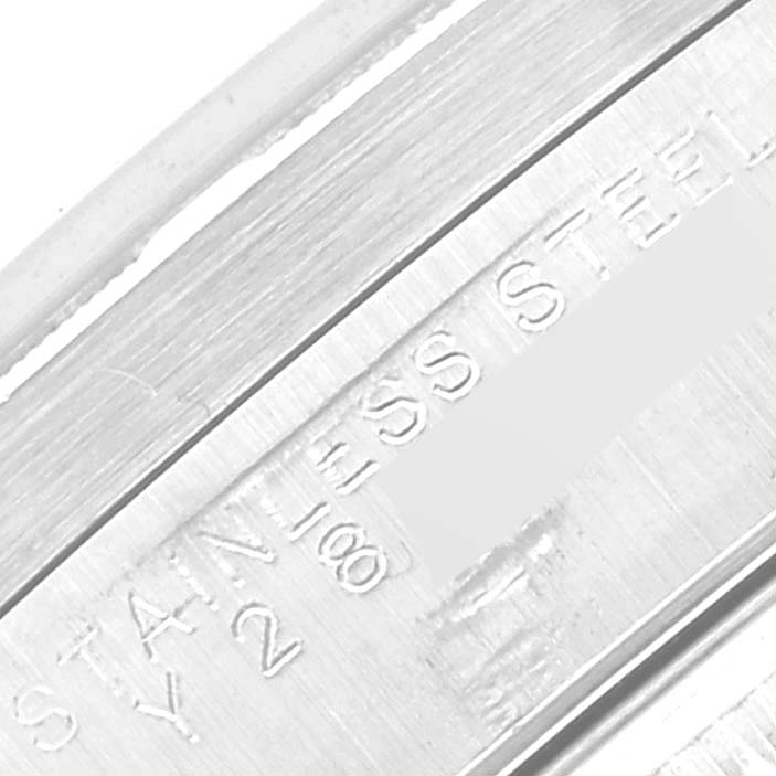 This image shows a close-up of the inner casing of a Rolex Date 15210 Men's Stainless Steel Blue Dial 15210 Men's Stainless Steel Blue Dial watch, highlighting the "STAINLESS STEEL" engraving.