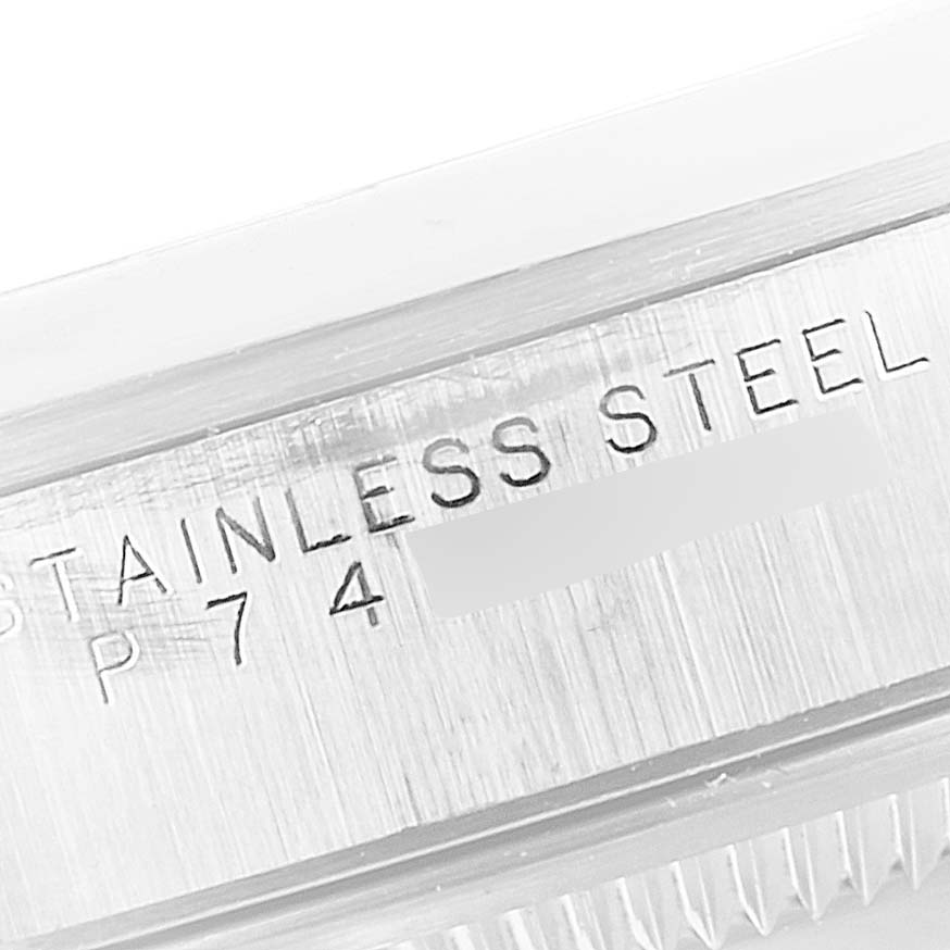 The image shows a close-up of the case side and reference number of a Rolex Date 15200 Men's Stainless Steel Blue Dial 15200 Men's Stainless Steel Blue Dial model watch.