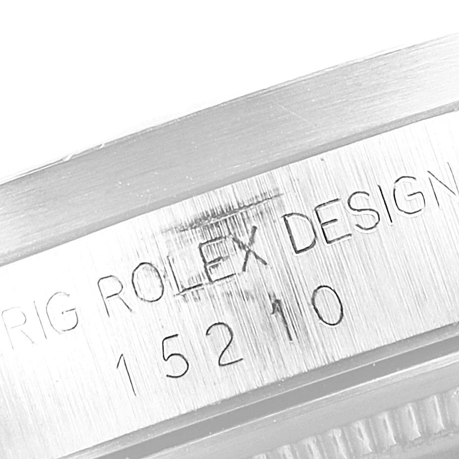 This image shows a close-up of the case number engraving on the side of a Rolex Date 15210 Men's Stainless Steel White Dial 15210 Men's Stainless Steel White Dial model watch.