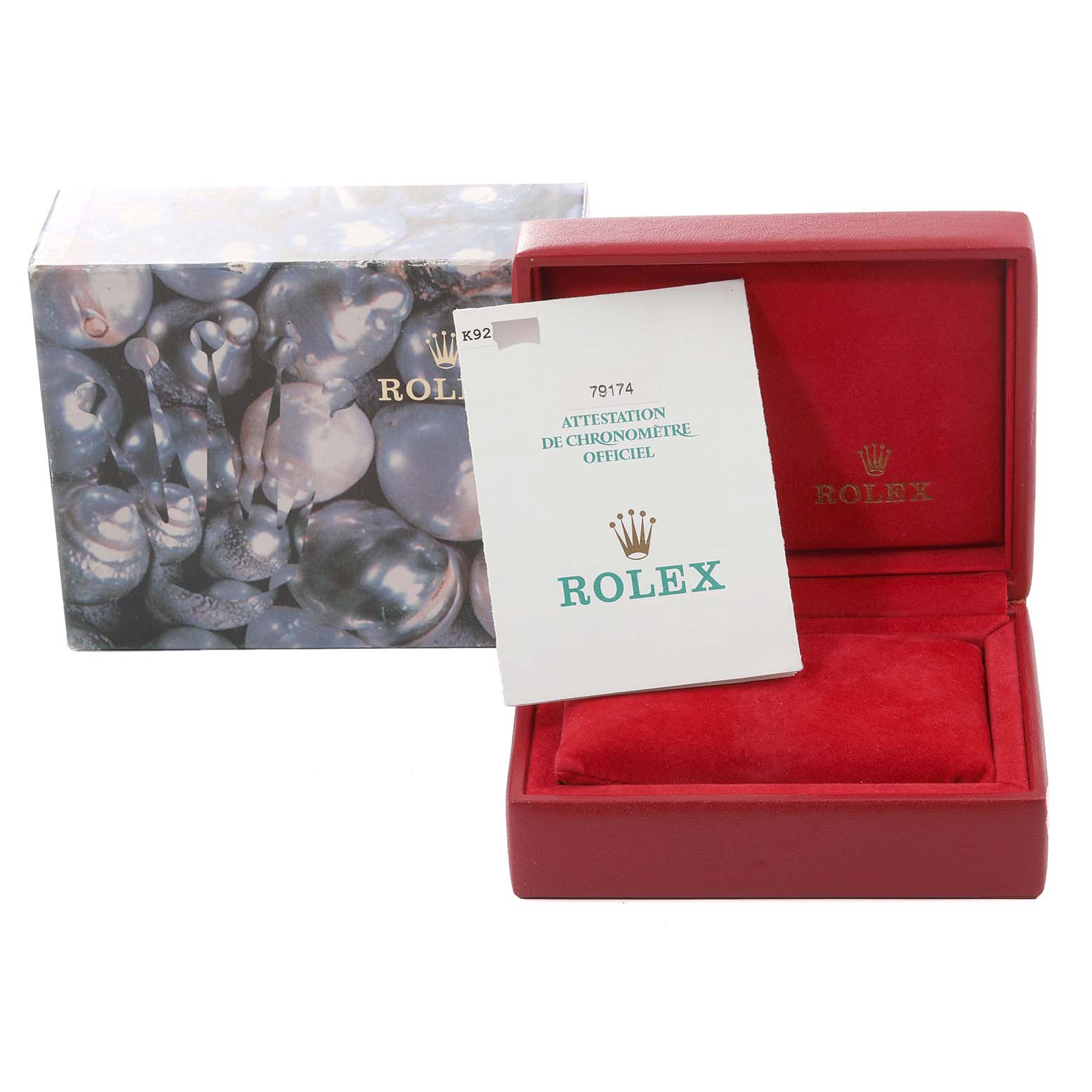This image shows the box and warranty card for a Rolex Datejust 79174 Women's Stainless Steel Silver Dial 79174 Women's Stainless Steel Silver Dial watch, with the box open and pamphlet inside.