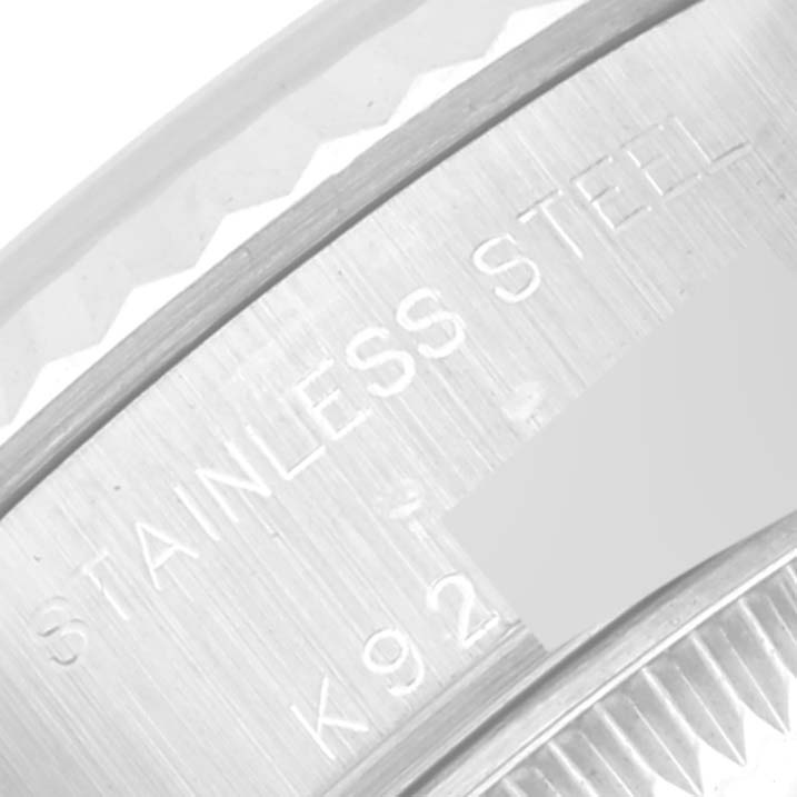 This image shows a close-up of the stainless steel engraving on the case of a Rolex Datejust 79174 Women's Stainless Steel Silver Dial 79174 Women's Stainless Steel Silver Dial watch.