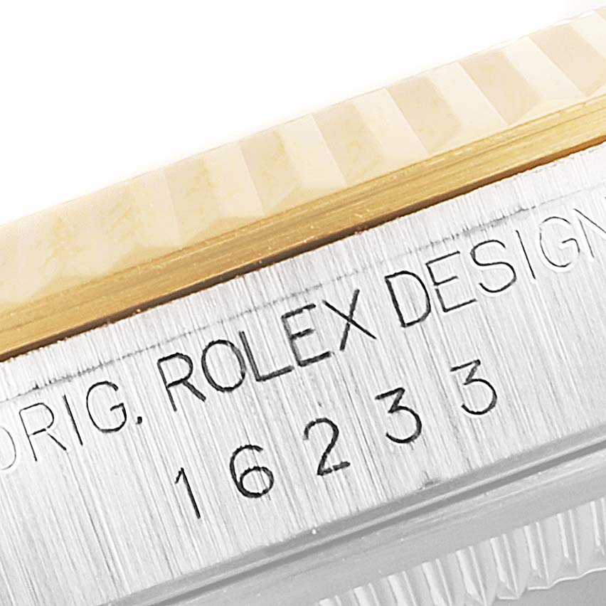 The image shows a close-up, angled view of the bezel and case edge of a Rolex Datejust 16233 Men's Steel and Gold (two tone) Champagne Dial 16233 Men's Steel and Gold (two tone) Champagne Dial model, with serial numbers visible.