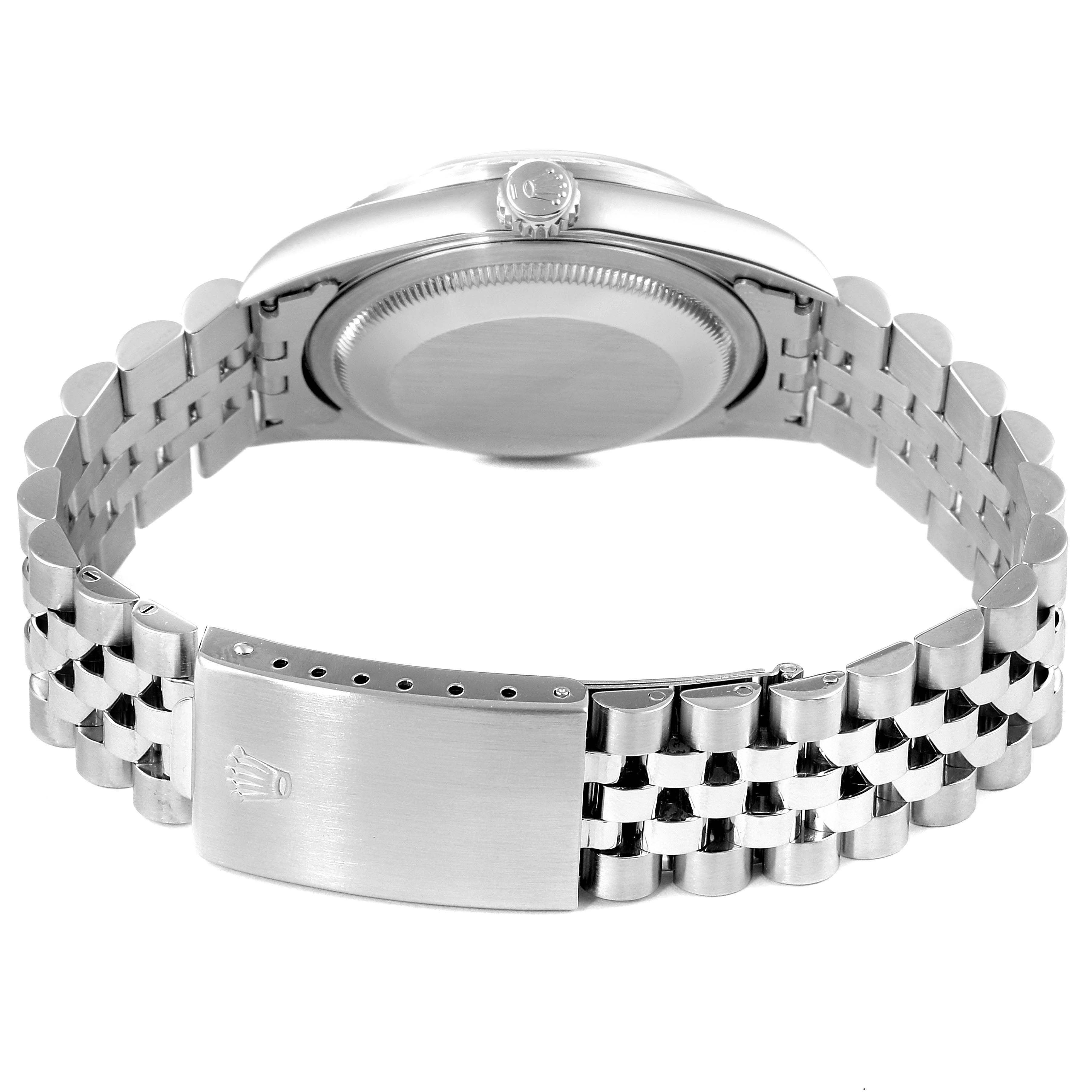 The image shows the back view of a Rolex Datejust 16220 Men's Stainless Steel White Dial 16220 Men's Stainless Steel White Dial watch, focusing on the case back and the Jubilee bracelet with the Rolex crown on the clasp.