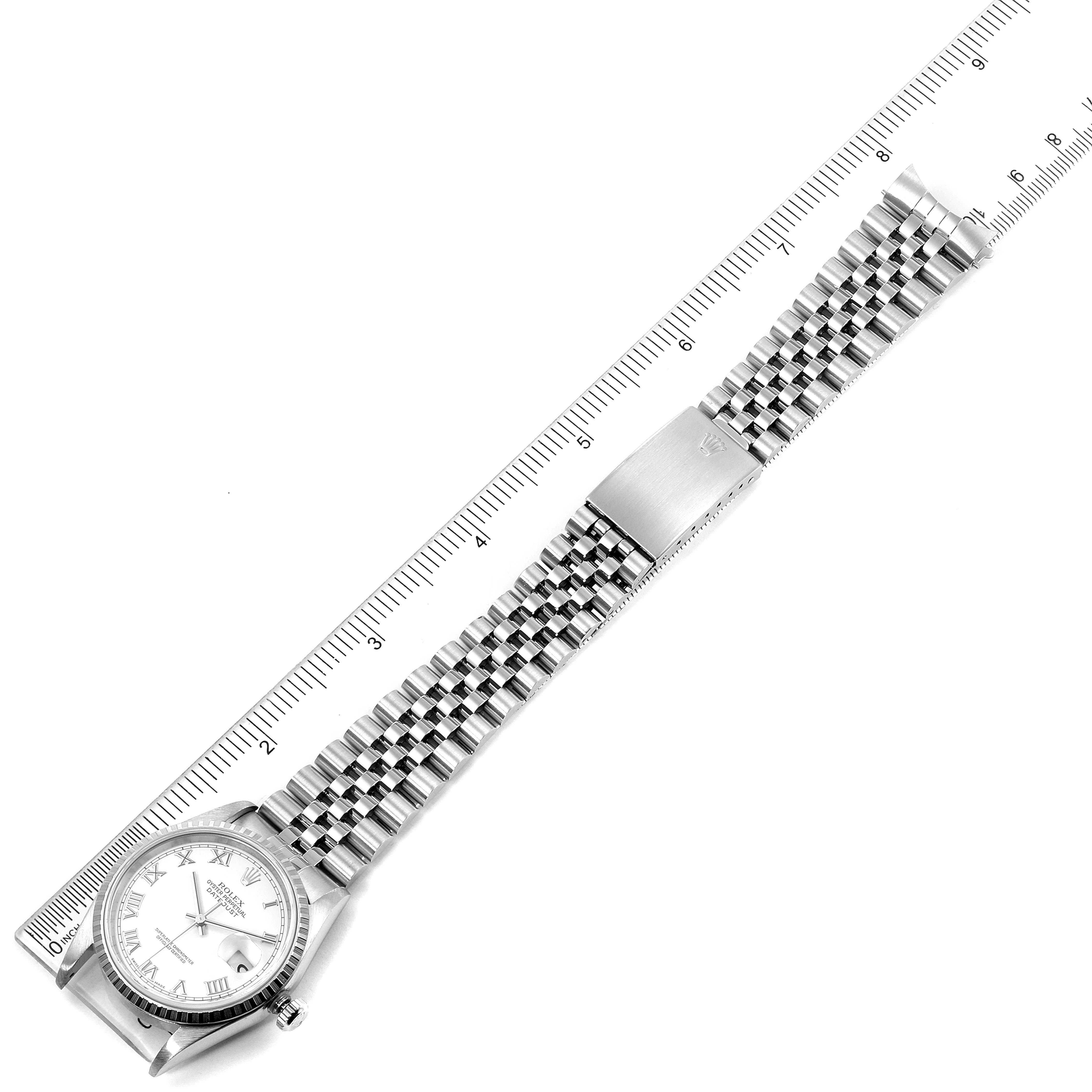 This image shows a Rolex Datejust 16220 Men's Stainless Steel White Dial 16220 Men's Stainless Steel White Dial watch laid flat with the face, bracelet, and clasp visible, alongside a ruler for scale.