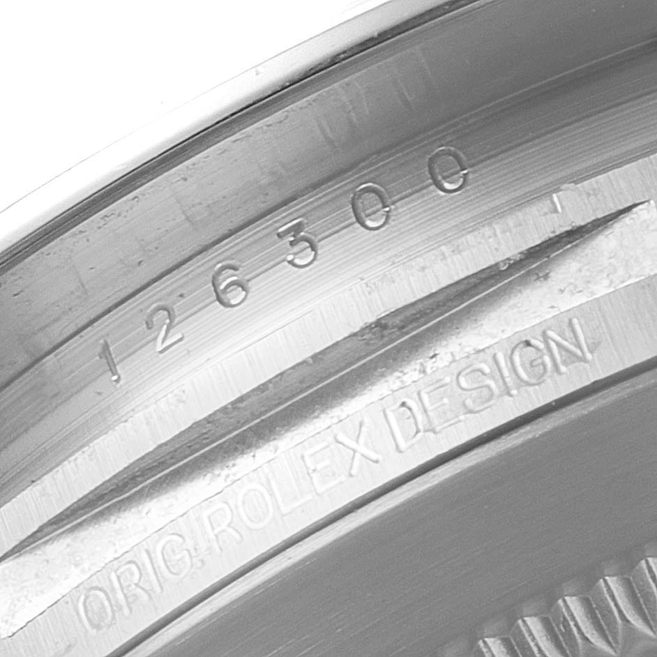 The image shows an angled close-up of the inner bezel of a Rolex Datejust 41 126300 Men's Stainless Steel Grey Dial 126300 Men's Stainless Steel Grey Dial, highlighting the model and design engravings.
