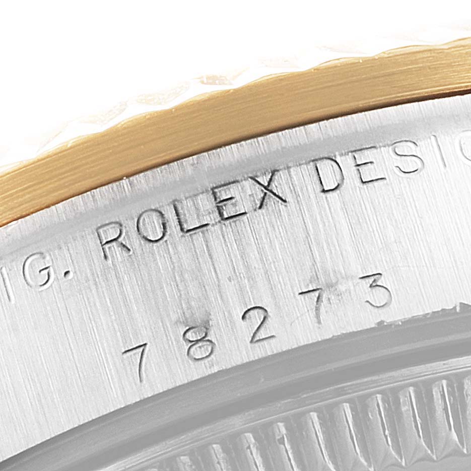 This image shows a close-up of the side bevel and model engraving on a Rolex Mid-Size 78273 Women
s Steel and Gold (two tone) Grey Dial 78273 Women
s Steel and Gold (two tone) Grey Dial watch.
