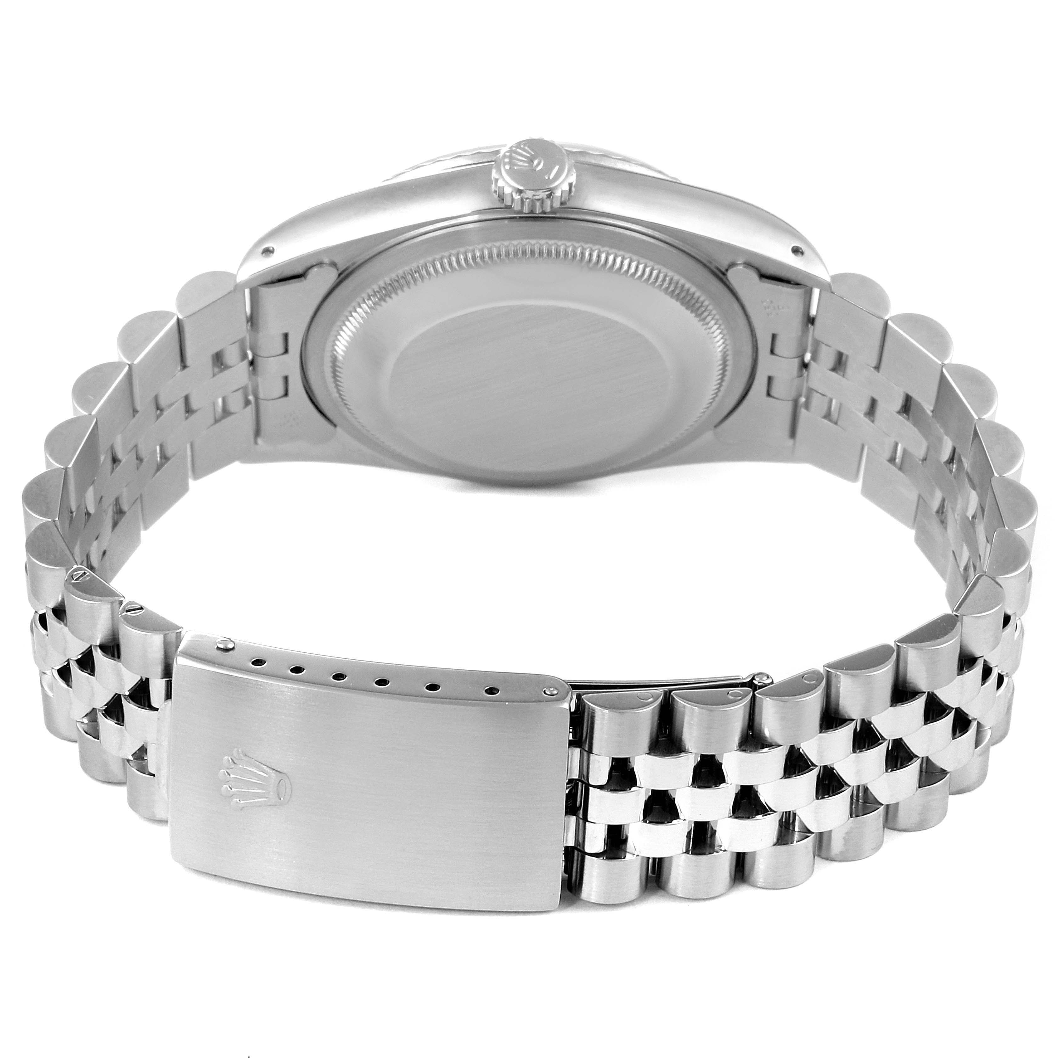 This image shows the back view of a Rolex Datejust 16234 Men's Stainless Steel Silver Dial 16234 Men's Stainless Steel Silver Dial watch, displaying its case back, crown, and metal bracelet with clasp.