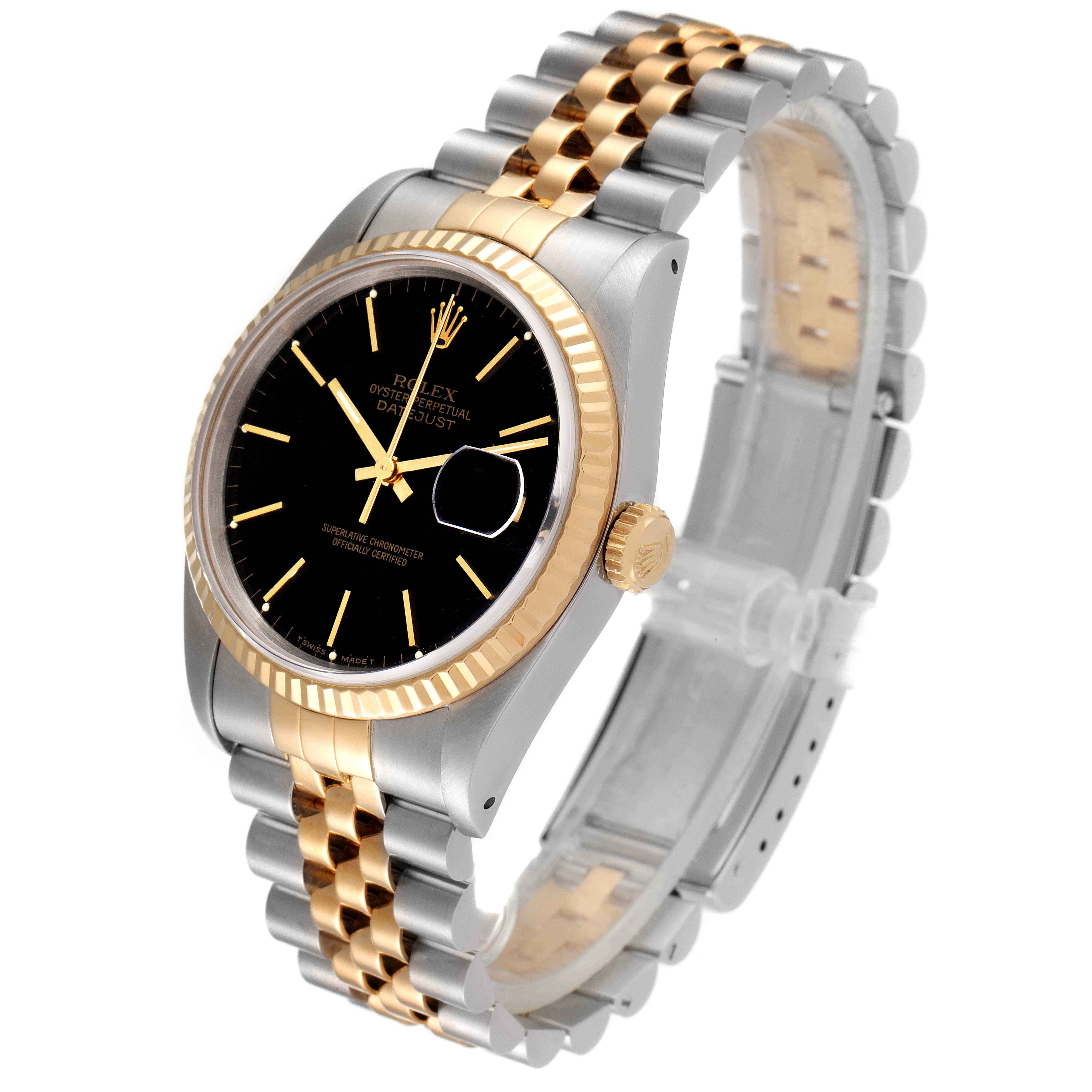 This image showcases a Rolex Datejust 16233 Men's Steel and Gold (two tone) Black Dial 16233 Men's Steel and Gold (two tone) Black Dial watch at an angle, highlighting its black dial, two-tone bracelet, and fluted bezel.