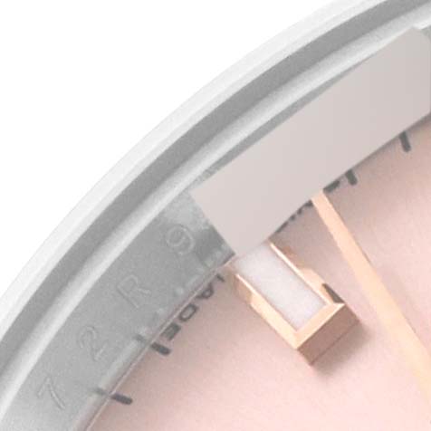 This image shows a close-up of the dial and part of the bezel of a Rolex Datejust 179171 Women's Steel and Gold (two tone) Pink Dial 179171 Women's Steel and Gold (two tone) Pink Dial watch.