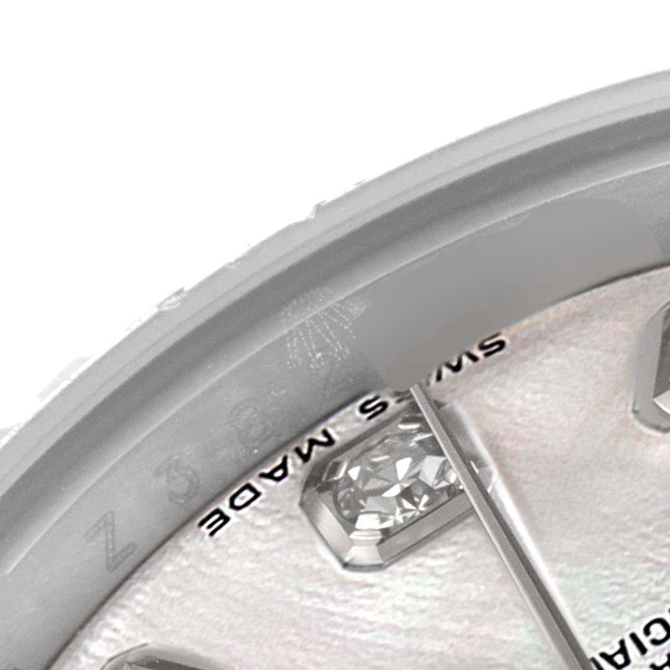 This close-up image shows part of the dial and markers of a Rolex Datejust 179174 Women's Stainless Steel Mother of Pearl Dial 179174 Women's Stainless Steel Mother of Pearl Dial watch at an angle.
