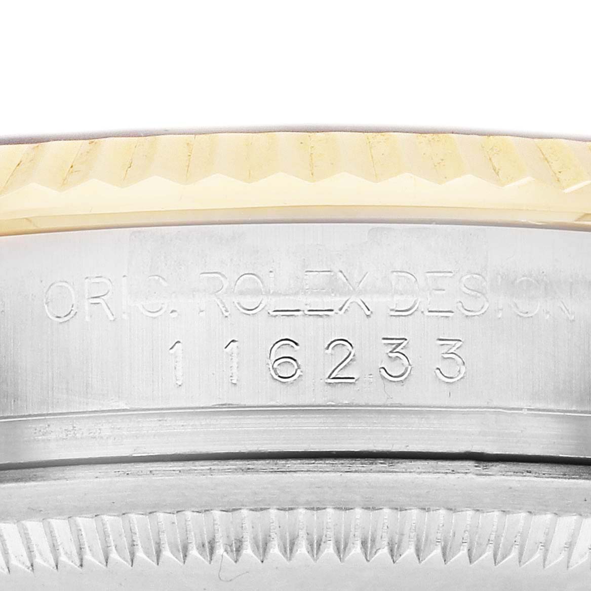 The image shows a close-up of the side of a Rolex Datejust 116233 Men's Steel and Gold (two tone) Black Dial watch, highlighting the engraved design and serial number.