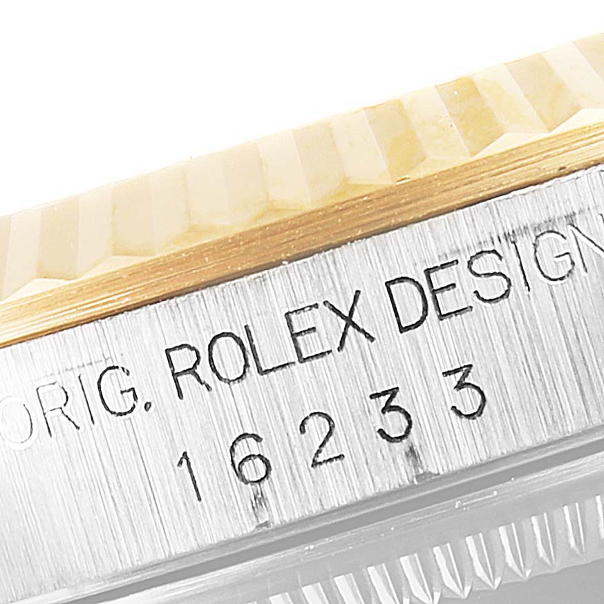 This image shows a close-up angle of the bezel and case side of the Rolex Datejust 16233 Men's Steel and Gold (two tone) Black Dial 16233 Men's Steel and Gold (two tone) Black Dial model.