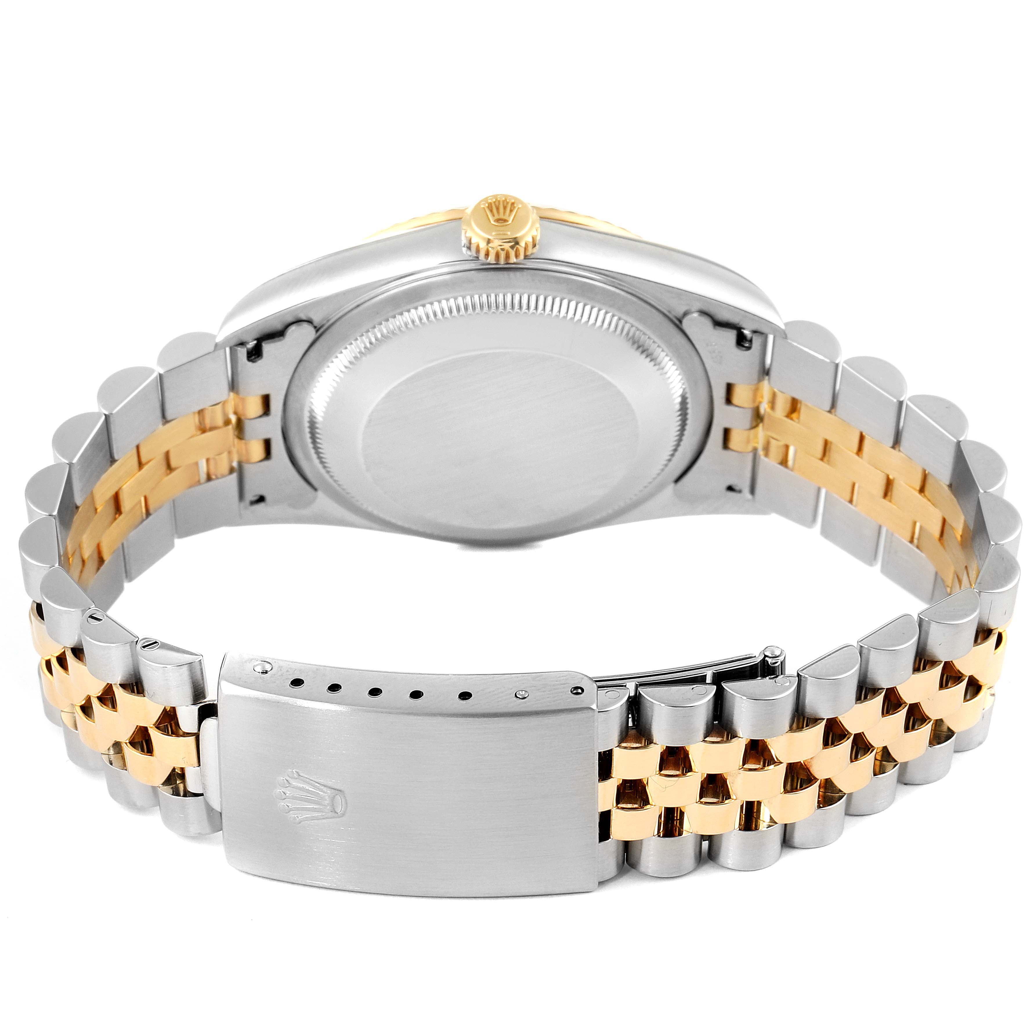 The image shows the back case and two-tone bracelet of a Rolex Datejust 16233 Men's Steel and Gold (two tone) Black Dial 16233 Men's Steel and Gold (two tone) Black Dial watch.