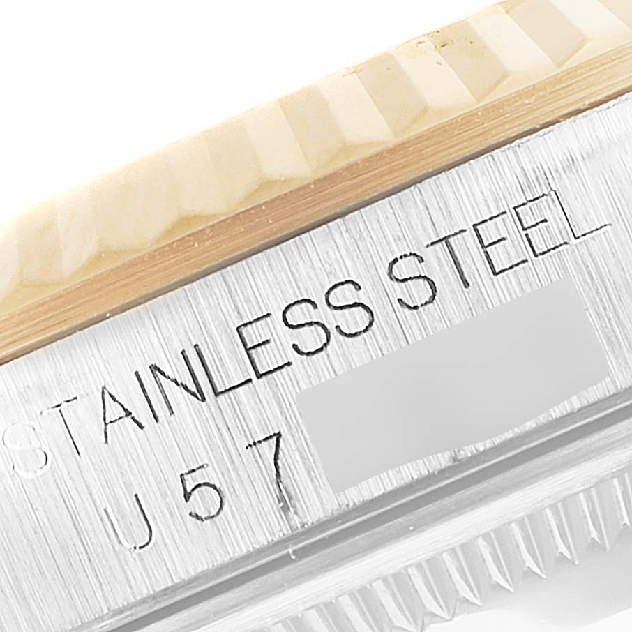 This image shows a close-up of the side engraving on a stainless steel Rolex Datejust 16233 Men's Steel and Gold (two tone) Black Dial 16233 Men's Steel and Gold (two tone) Black Dial watch.