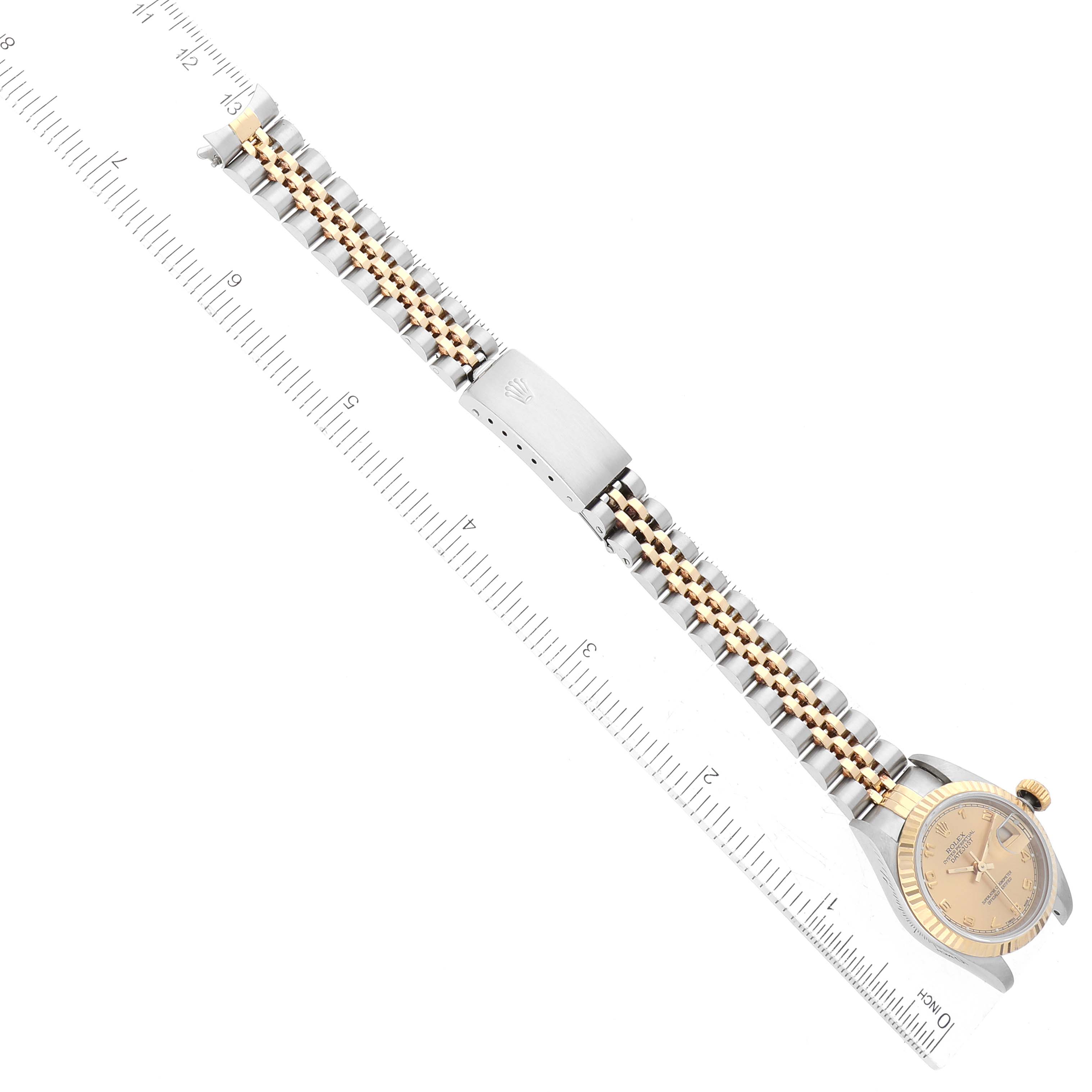 The image shows the entire Rolex Datejust 69173 Women's Steel and Gold (two tone) Champagne Dial 69173 Women's Steel and Gold (two tone) Champagne Dial watch, including its face, crown, bezel, and two-tone bracelet.