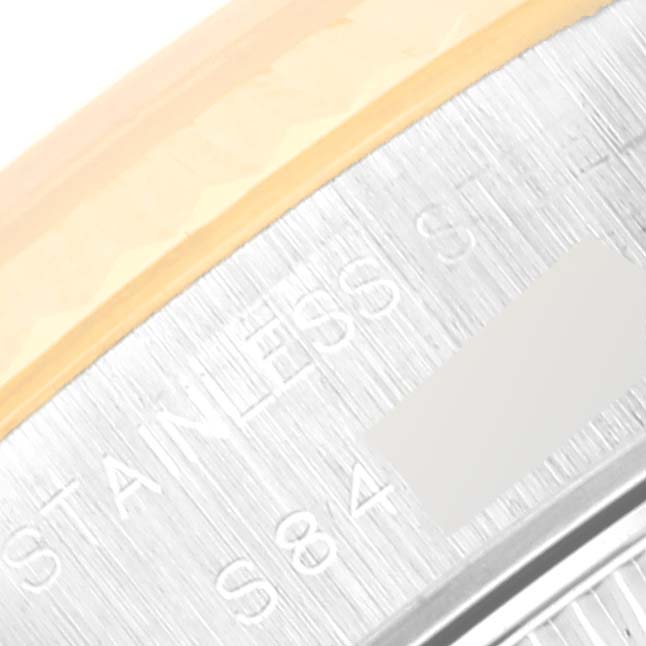 The image shows a close-up of the bezel and part of the bracelet with "STAINLESS" engraved on the Rolex Datejust 69173 Women's Steel and Gold (two tone) Champagne Dial 69173 Women's Steel and Gold (two tone) Champagne Dial watch.