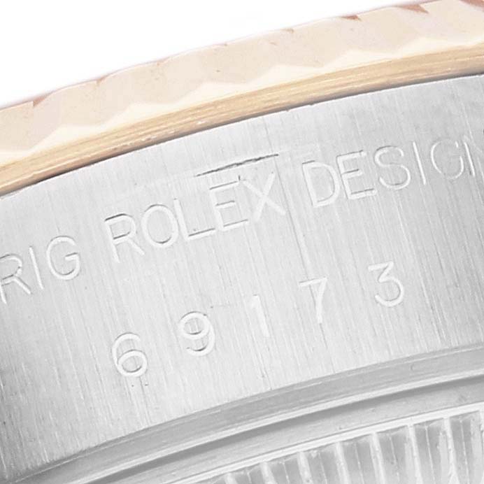 This close-up image shows the engraved case side and bezel of a Rolex Datejust 69173G Women's Steel and Gold (two tone) White Dial 69173G Women's Steel and Gold (two tone) White Dial watch, featuring the model number "69173."