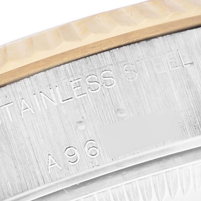 This close-up image shows the stainless steel casing and part of the bezel on a Rolex Datejust 79173 Women's Steel and Gold (two tone) Red Dial 79173 Women's Steel and Gold (two tone) Red Dial watch.