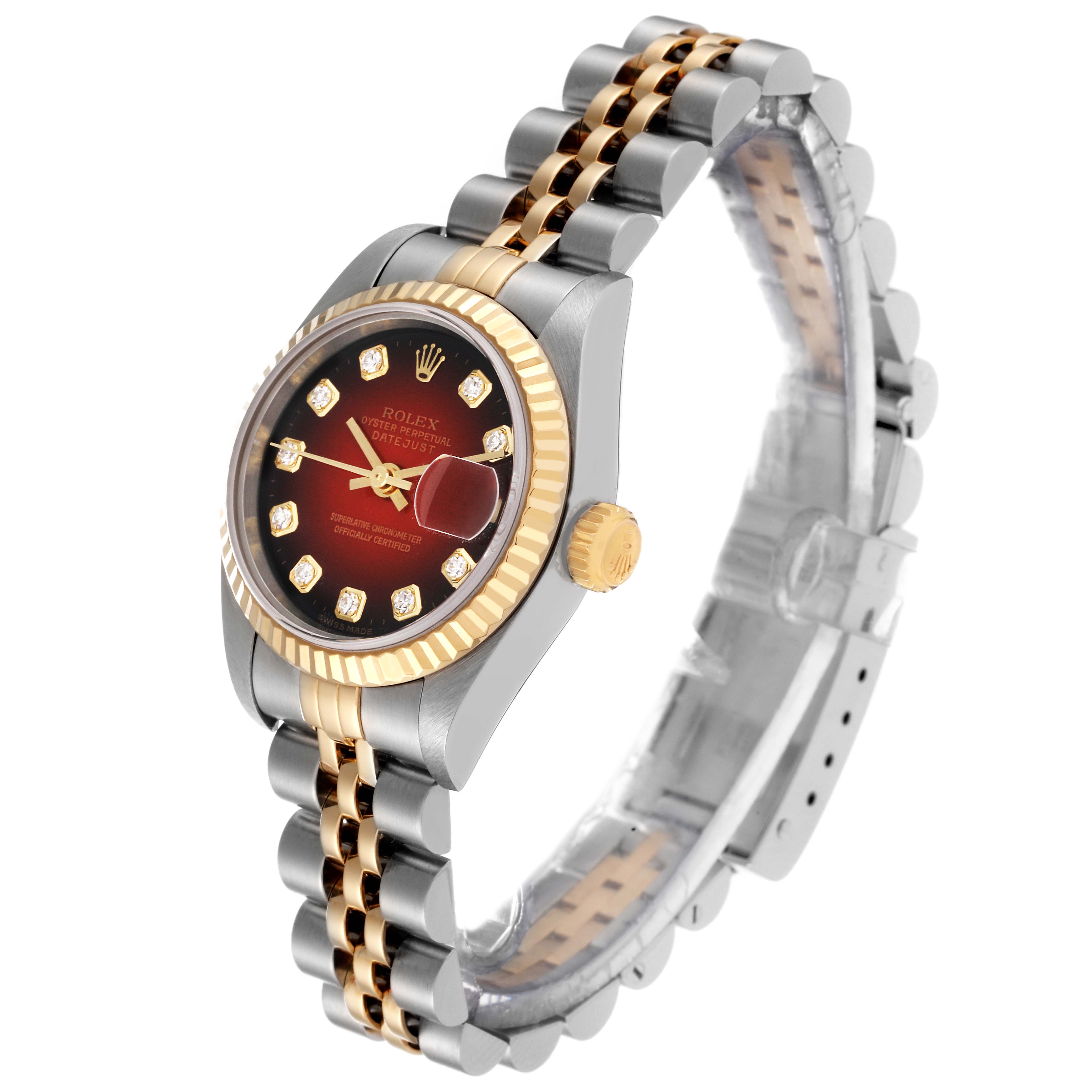 This image shows a Rolex Datejust 79173 Women's Steel and Gold (two tone) Red Dial 79173 Women's Steel and Gold (two tone) Red Dial watch angled to display its face, bezel, crown, and bracelet.