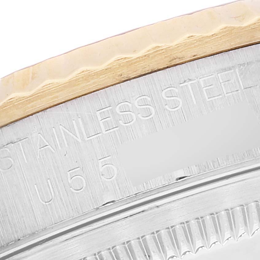 This close-up image shows the bezel and part of the stainless steel casing of the Rolex Datejust 16233 Men's Steel and Gold (two tone) Mother of Pearl Dial 16233 Men's Steel and Gold (two tone) Mother of Pearl Dial watch.