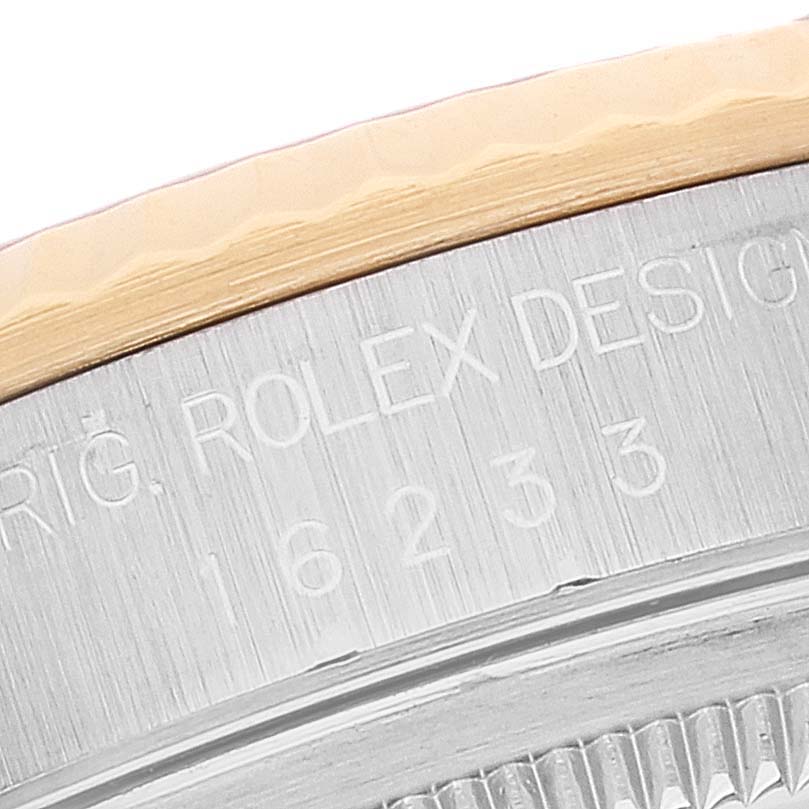 This close-up image shows the case and bezel of the Rolex Datejust 16233 Men's Steel and Gold (two tone) Mother of Pearl Dial 16233 Men's Steel and Gold (two tone) Mother of Pearl Dial watch, highlighting the engraved model number.