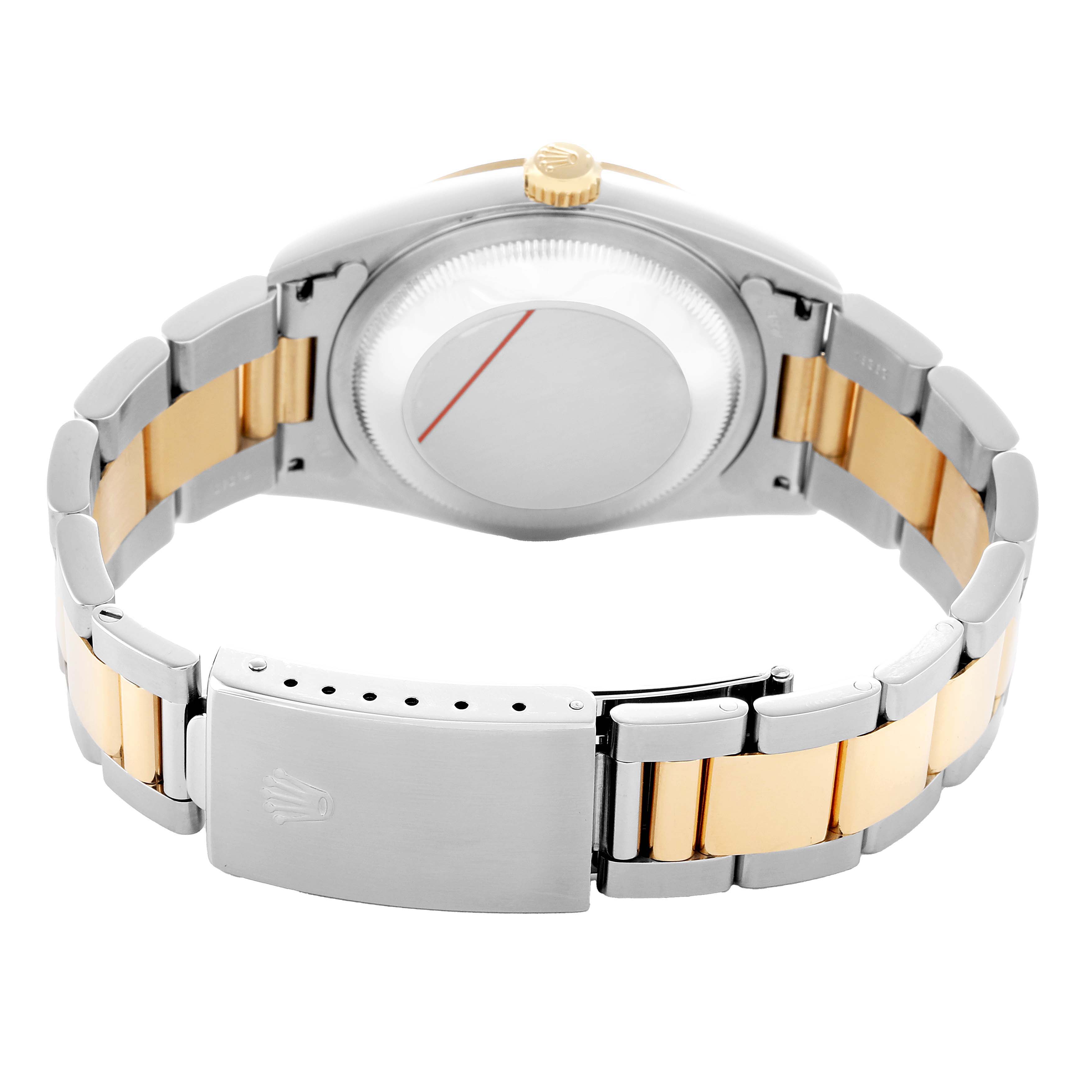 The image shows the back view of a Rolex Datejust 16203 Men's Steel and Gold (two tone) White Dial, highlighting the case back, crown, and two-tone bracelet with a clasp.