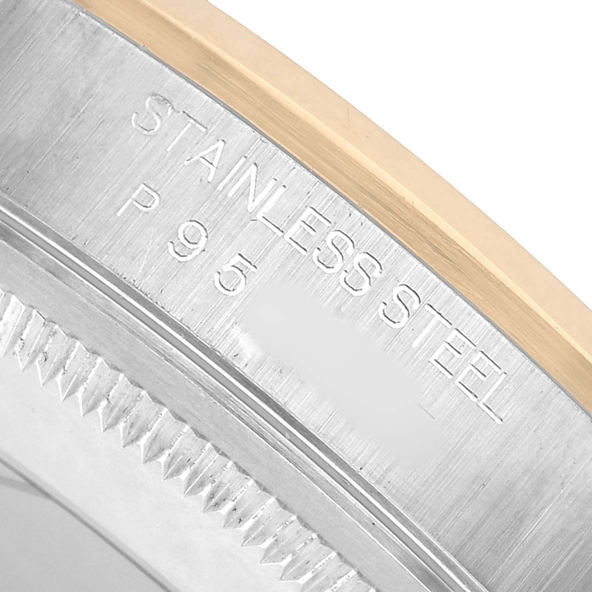 The image shows a close-up of the stainless steel and gold bezel on a Rolex Datejust 16203 Men's Steel and Gold (two tone) White Dial watch.