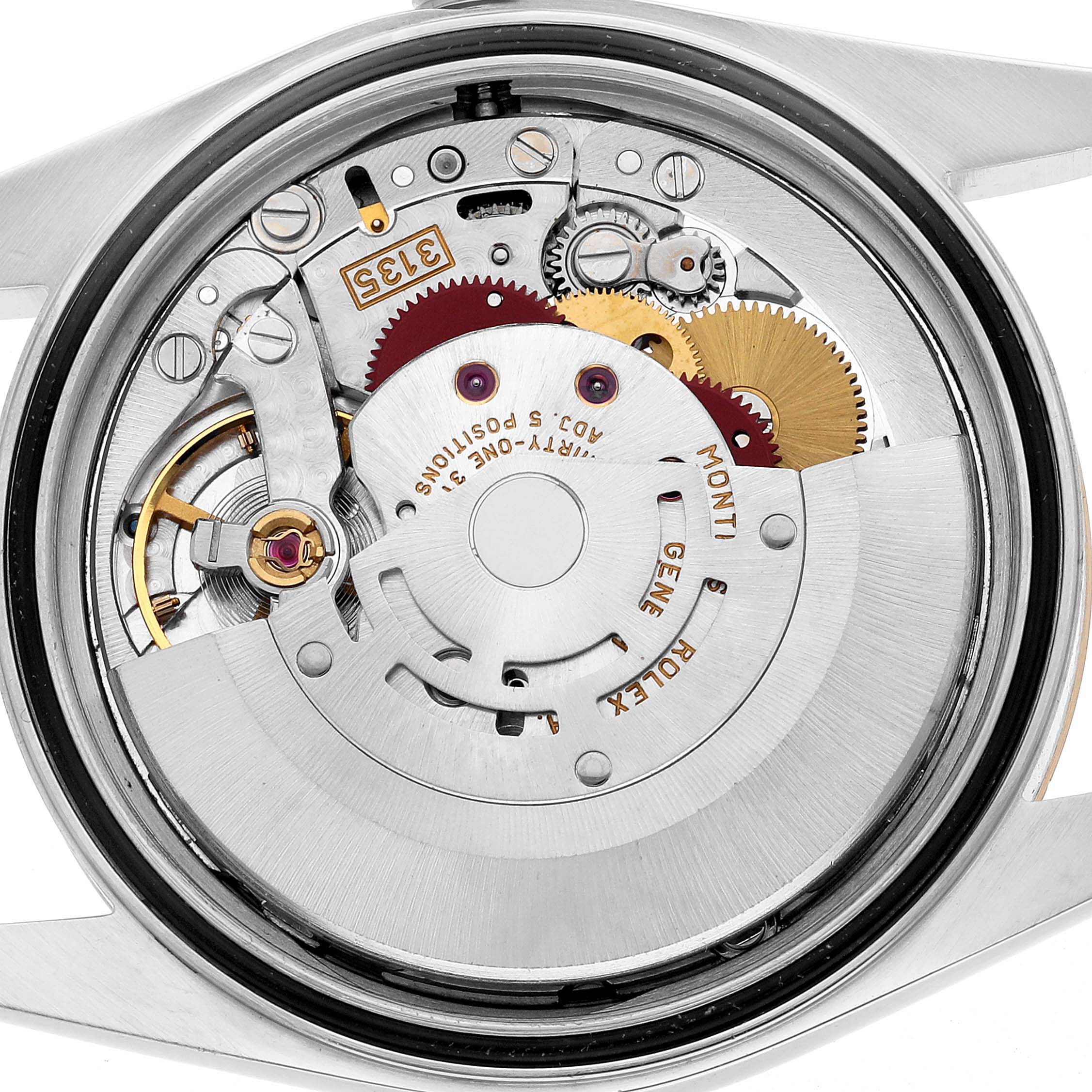 The image shows the movement of a Rolex Datejust 16203 Men's Steel and Gold (two tone) White Dial watch from the back, highlighting gears and mechanical components.
