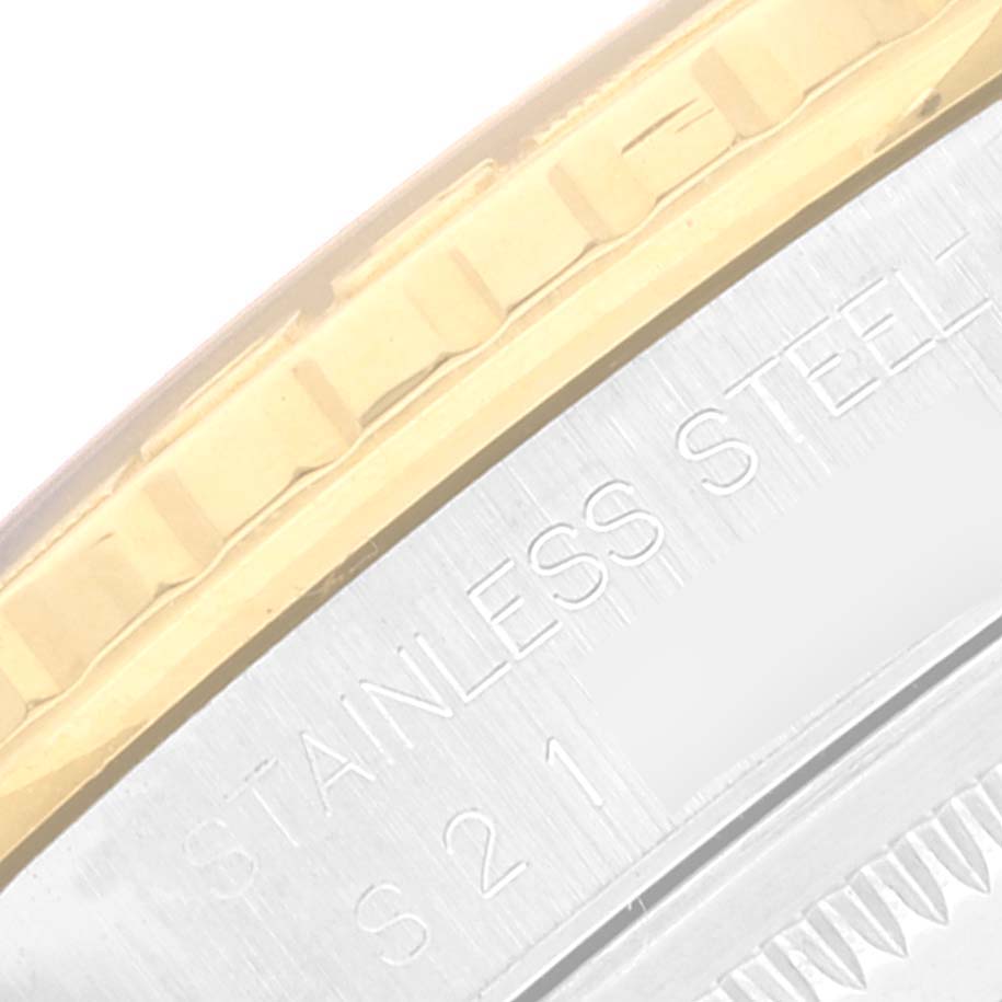 The image shows a close-up of the bezel and part of the casing of the Rolex Turn-o-Graph 16263 Men's Steel and Gold (two tone) Champagne Dial 16263 Men's Steel and Gold (two tone) Champagne Dial watch, highlighting the "Stainless Steel" engraving.
