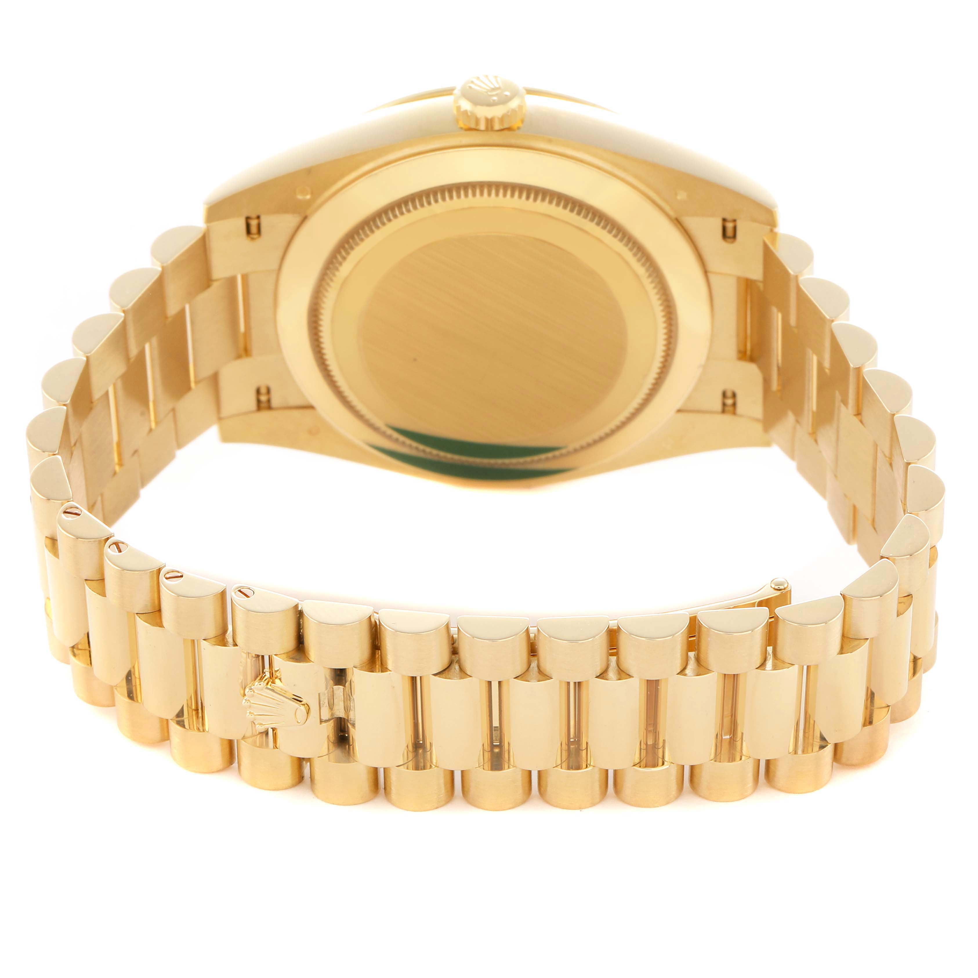 The Rolex President 228348 Men's Yellow Gold Champagne Dial watch is shown from the rear, highlighting the case back and signature gold bracelet.