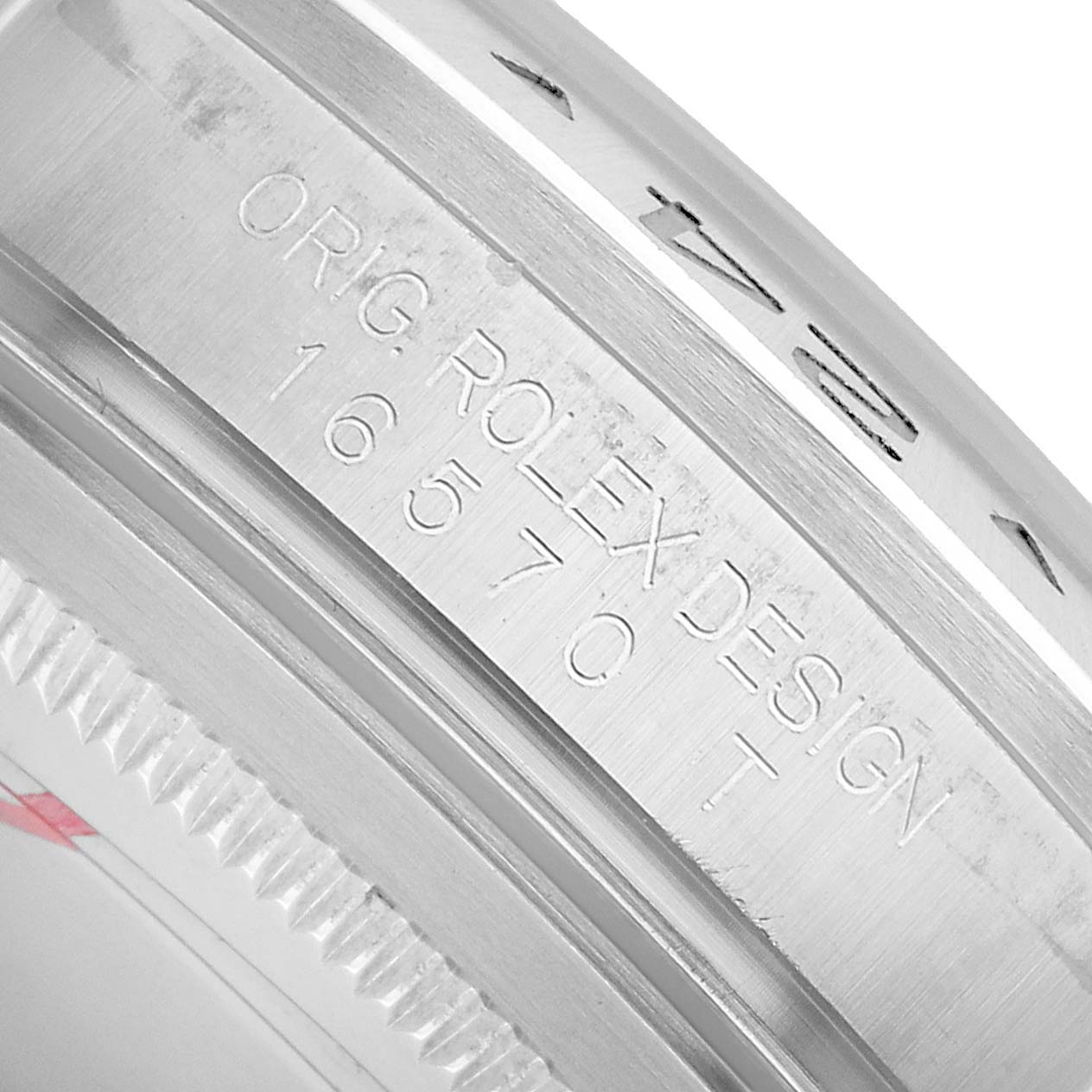 The image shows a close-up of the engraved side of a Rolex Explorer 16570 Men's Stainless Steel White Dial case, displaying model details.