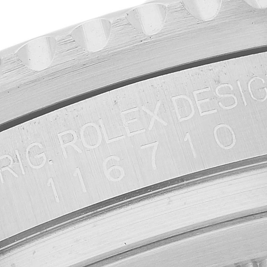 The image shows a close-up view of the model number (116710) and the bezel edge of the Rolex GMT-Master 116710 Men
s Stainless Steel Black Dial 116710 Men
s Stainless Steel Black Dial watch.