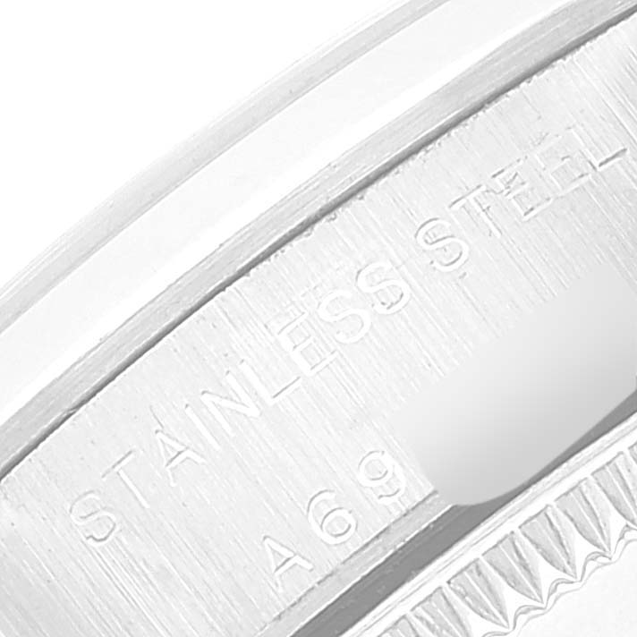 The image shows a close-up of the side engraving on a Rolex Oyster Perpetual 76080 Women's Stainless Steel Blue Dial 76080 Women's Stainless Steel Blue Dial watch, indicating it is made of stainless steel.